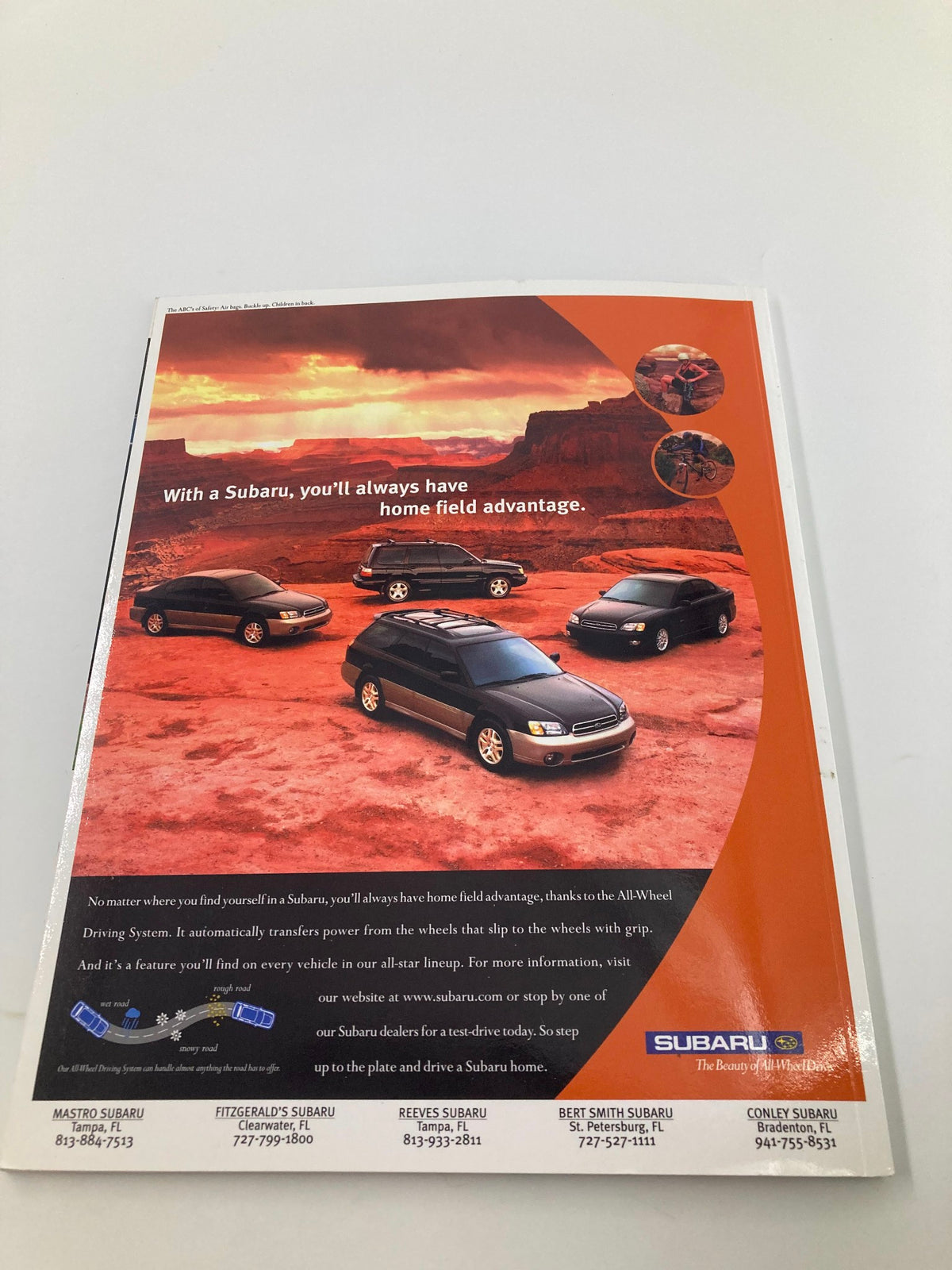 2000 MLB Devil R Us Yearbook advertisement for Subaru, emphasizing the vehicle's advantages in an outdoor scenic setting.