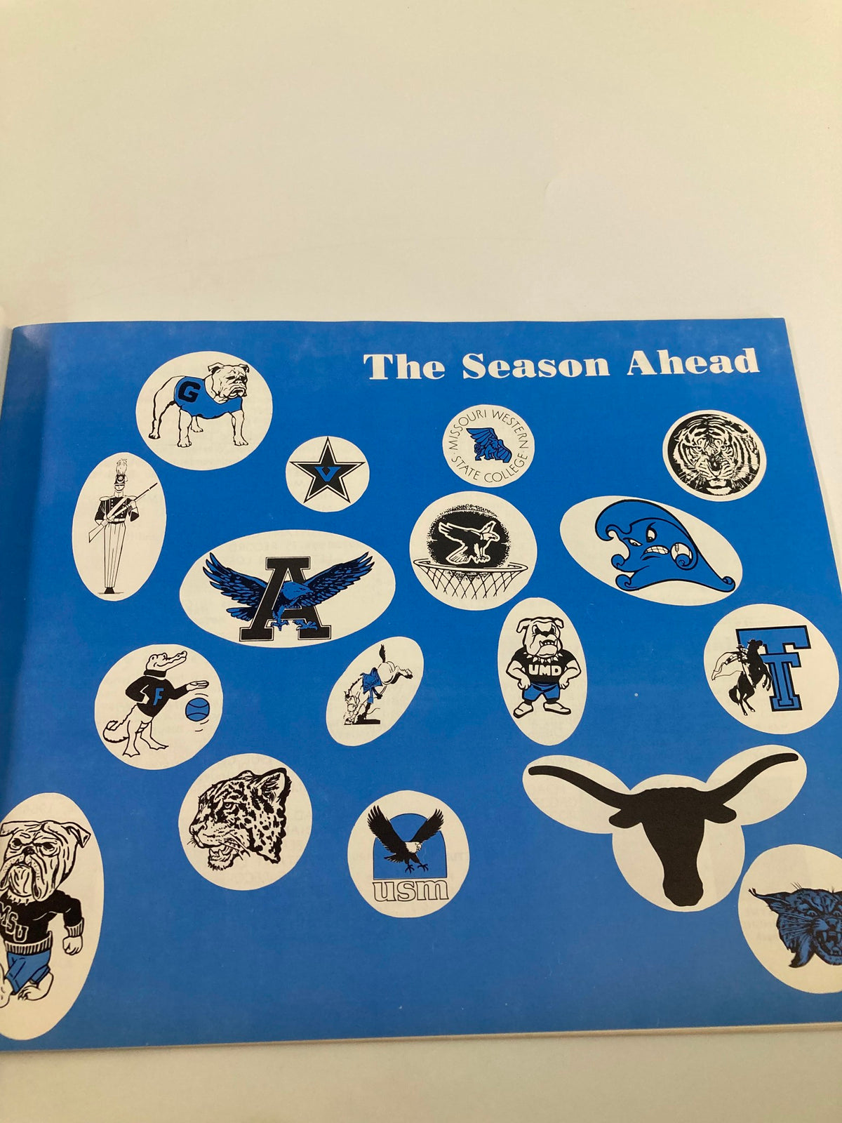Artwork showcasing various team logos from the 1975-1976 Rebel Basketball University of Mississippi Basketball Guide.