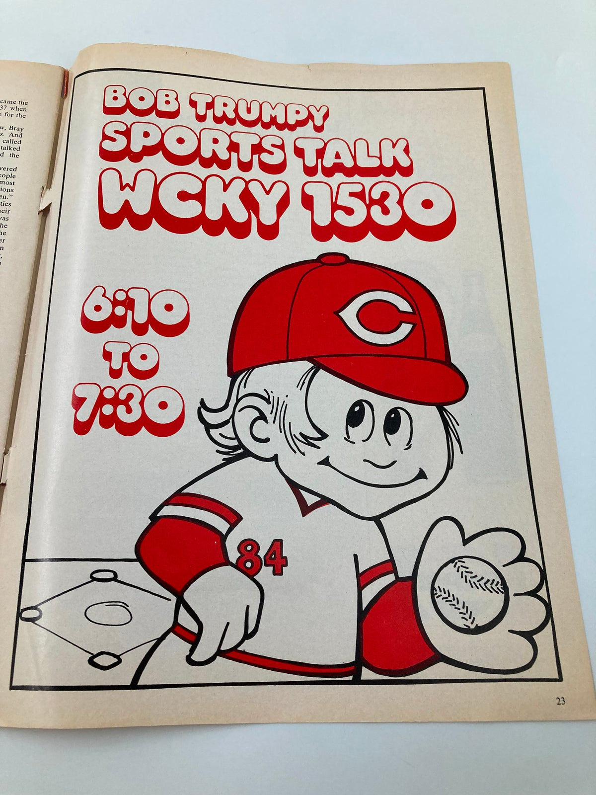 Illustration from February 1979 Vol 1 #3 Reds Vue Spring Training Opens Official Magazine showing Bob Trumpy Sports Talk advertisement on WCKY 1530, featuring a cartoon character in Cincinnati Reds gear.