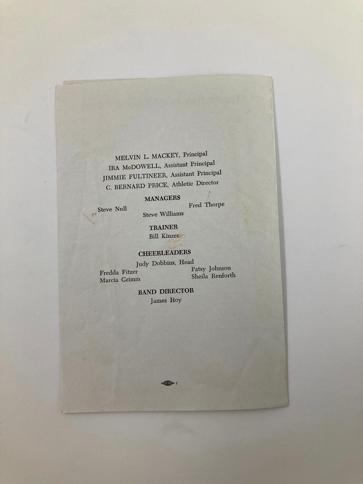 Back page of the October 16, 1964 High School Football Program detailing the faculty, trainers, cheerleaders, and band director.