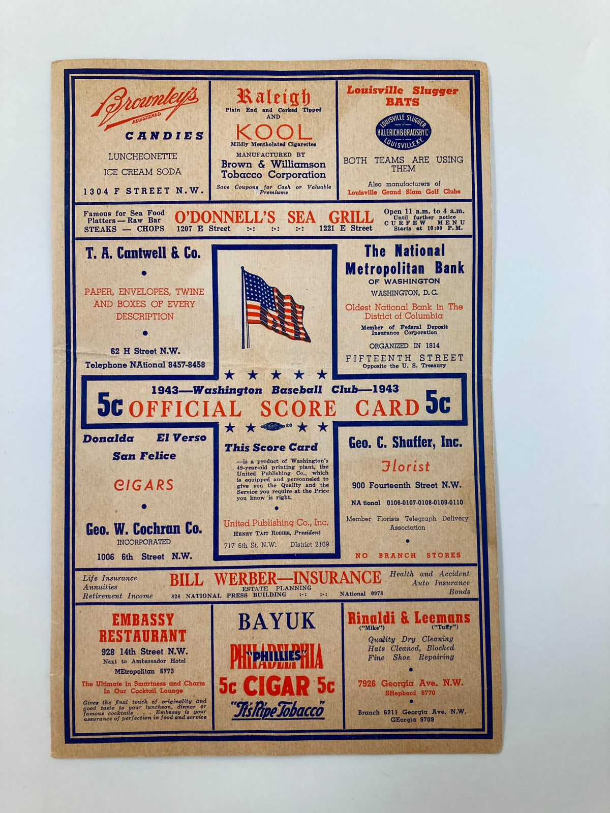 1943 Washington Senators MLB Baseball Club Official Score Card showcasing advertisements, historical graphics, and a patriotic theme.
