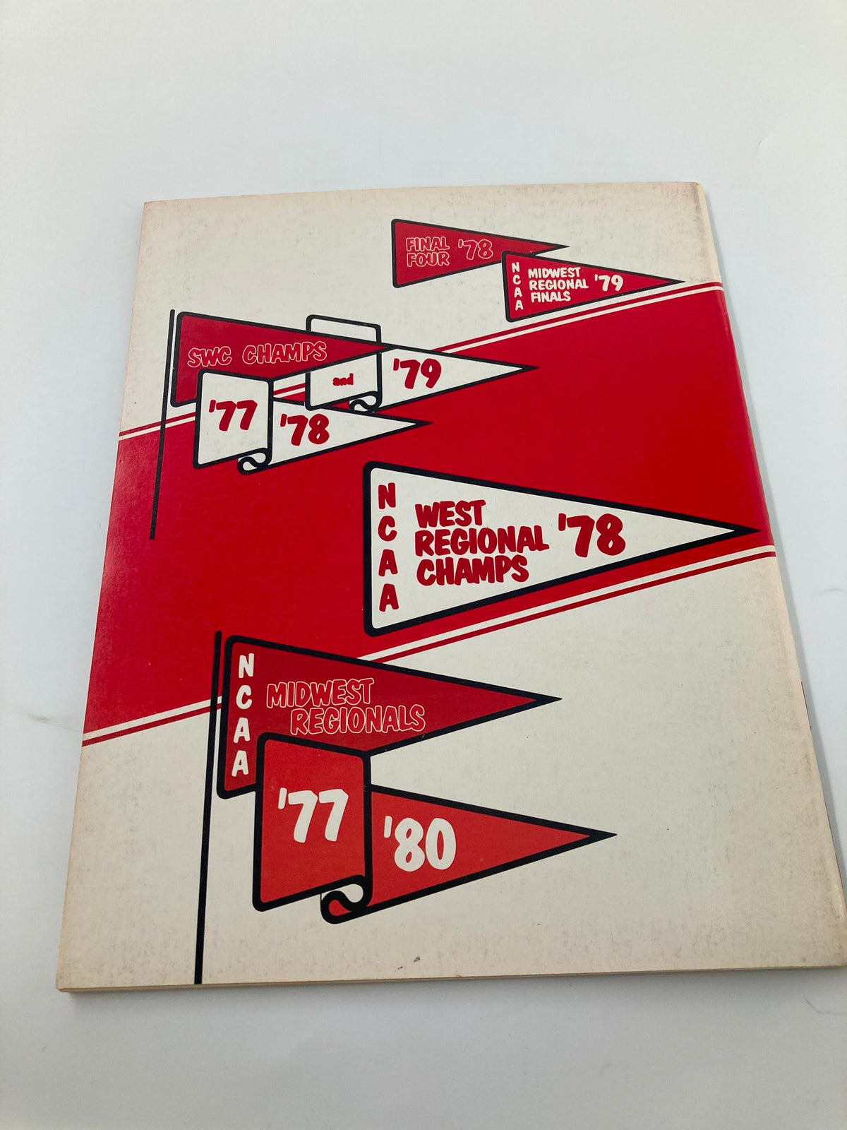 1980-1981 College Arkansas Basketball Official Program cover featuring championship banners, symbolizing the team's achievements in NCAA basketball.