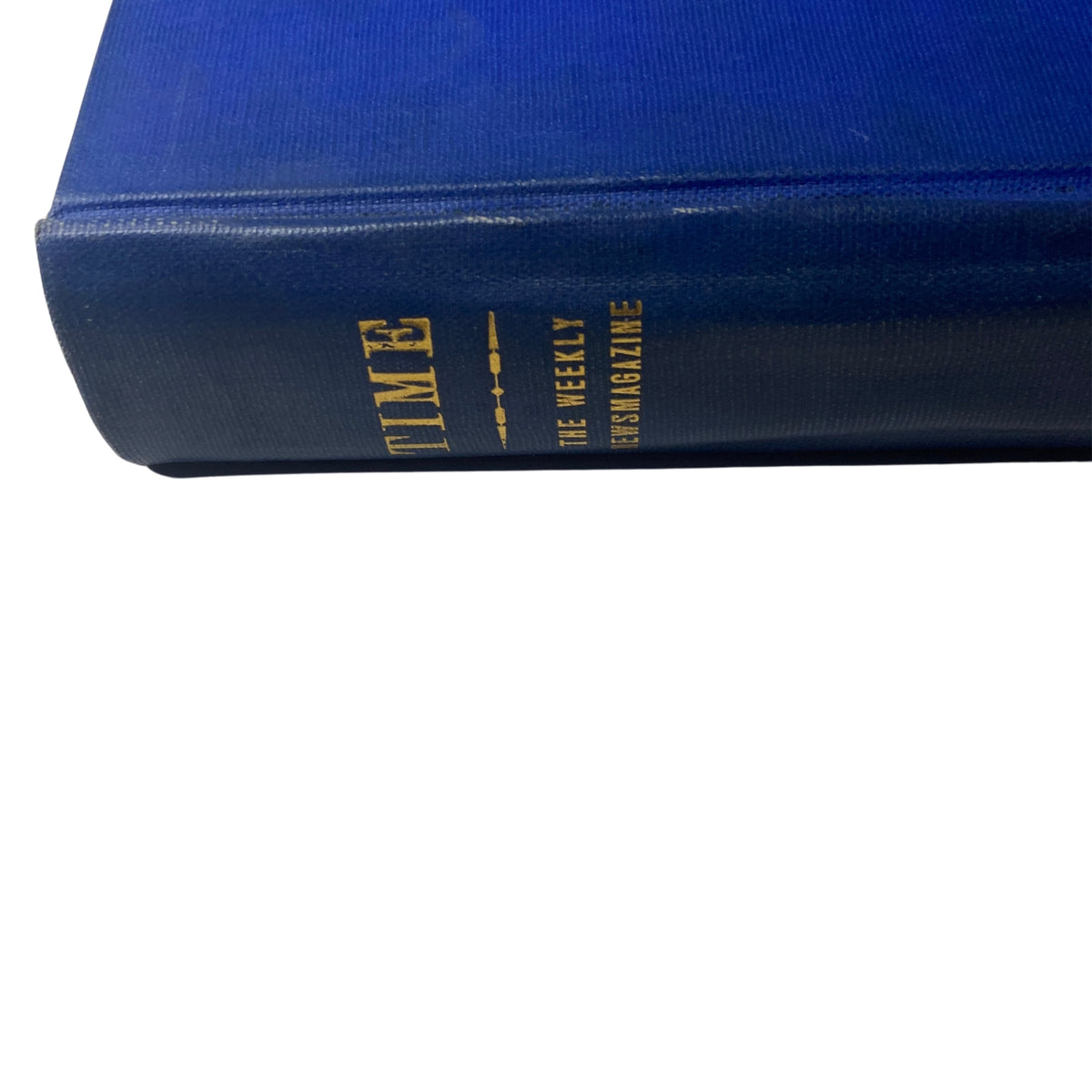 Close-up side view of the Time Magazine Library Bound Weekly, January 1 to March 26, 1951, emphasizing the gold lettering of the title on the spine of the blue hardcover.