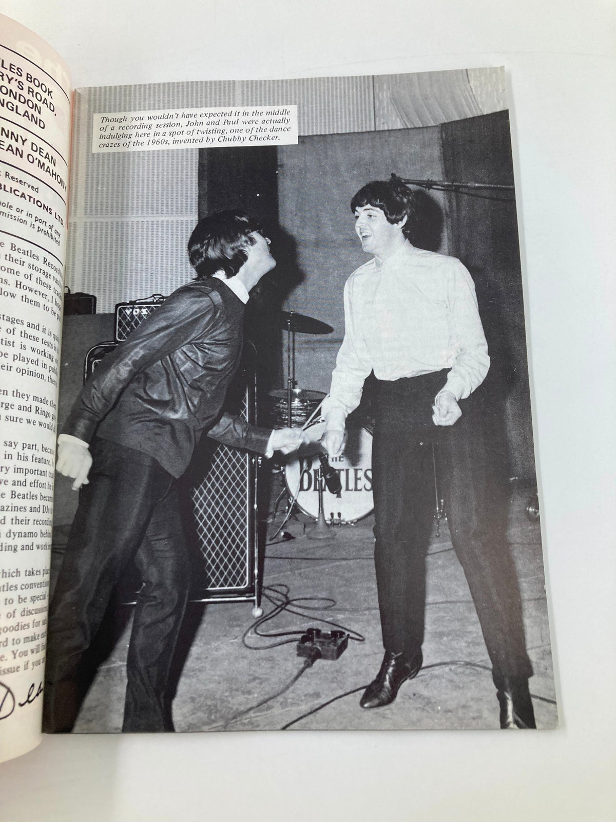 The Beatles Book Monthly Magazine October 1988 No. 150 featuring John Lennon and Paul McCartney dancing during a recording session, capturing their playful spirit in the 1960s.