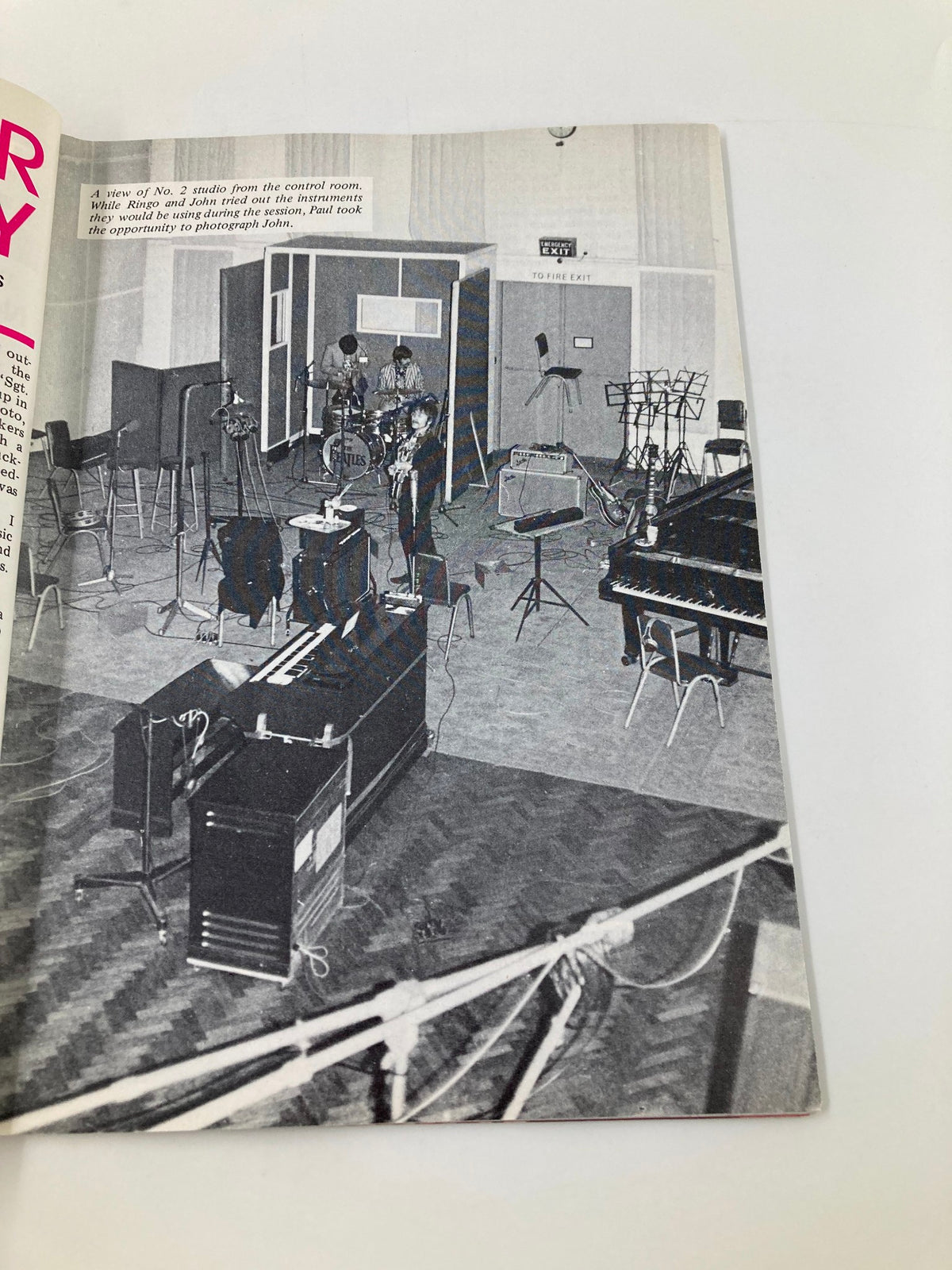 A historical photograph included in The Beatles Book Monthly Magazine June 1987 No. 134 showing The Beatles in Studio 2, capturing the essence of their recording process.