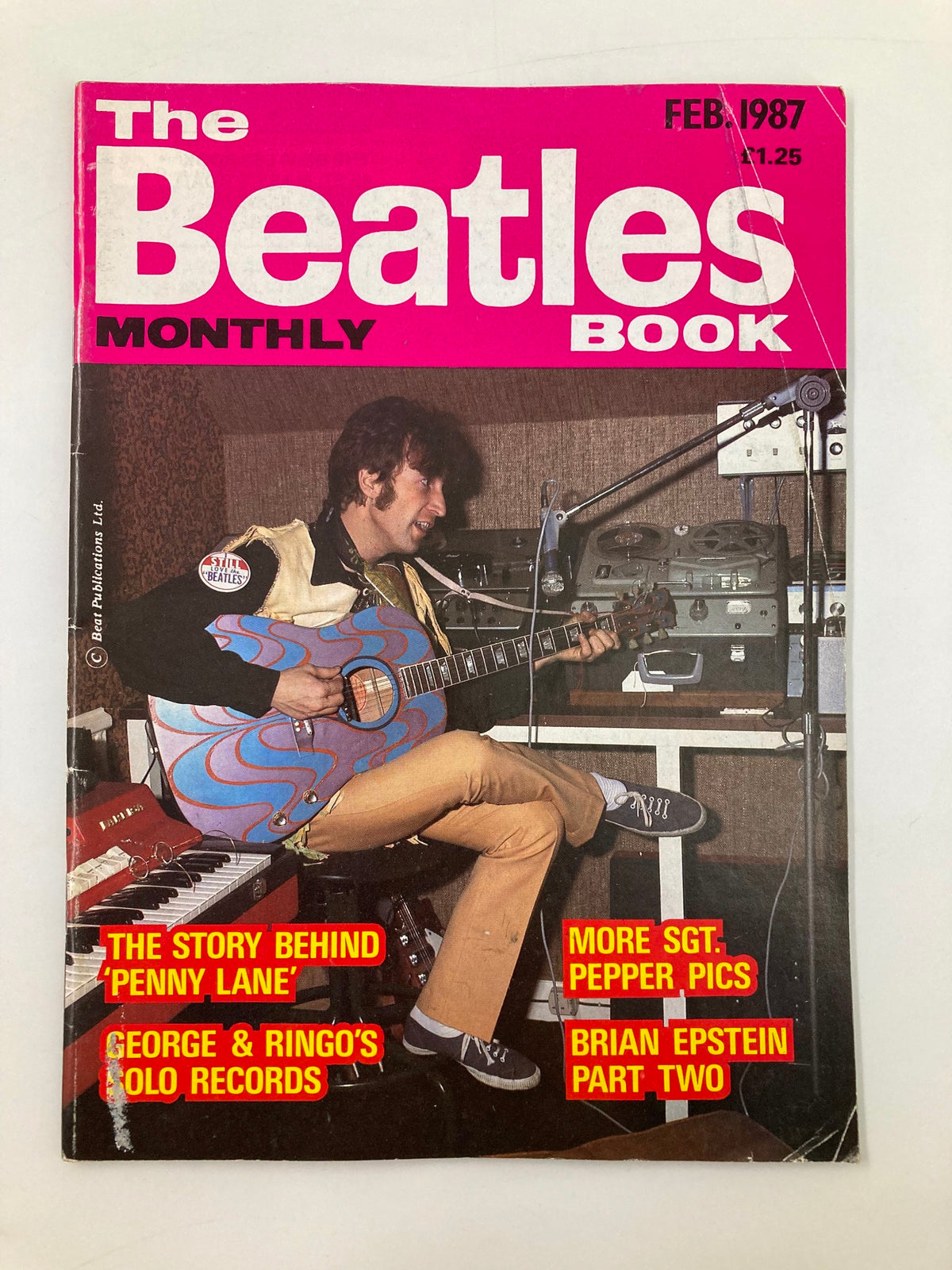 The Beatles Book Monthly Magazine February 1987 Issue #130 featuring a colorful cover with prominent title text and an illustration of a musician playing guitar.