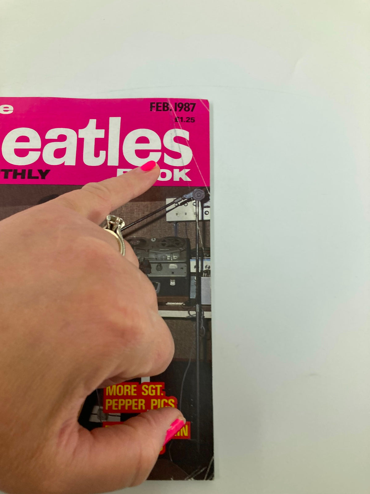 Close-up view of The Beatles Book Monthly Magazine February 1987 Issue #130 cover, highlighting the issue's title and key feature topics.