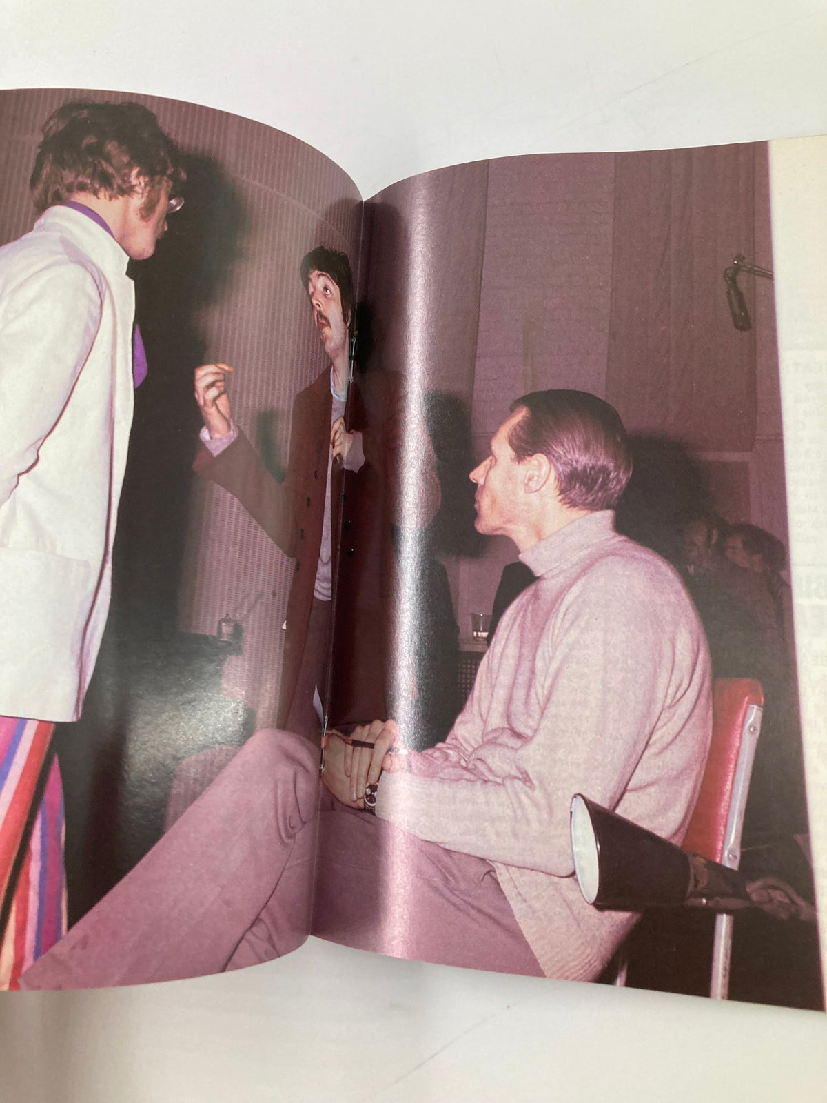 A two-page spread in The Beatles Book Monthly Magazine February 1987 Issue #130, depicting a candid moment between band members during a recording session.