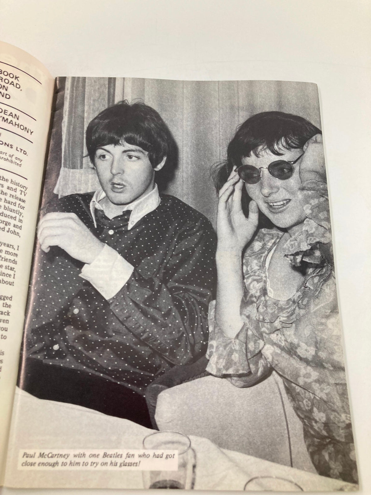 Paul McCartney with a fan in The Beatles Book Monthly Magazine August 1986 Issue #124, capturing a candid moment during their time.