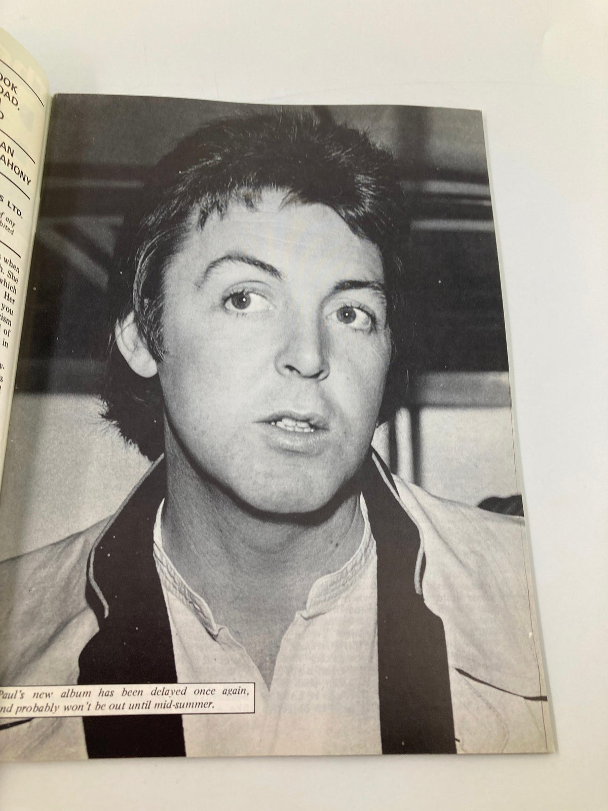 Black and white photo of Paul McCartney featured in The Beatles Book Monthly Magazine May 1986 Issue #121, addressing his delayed album release.