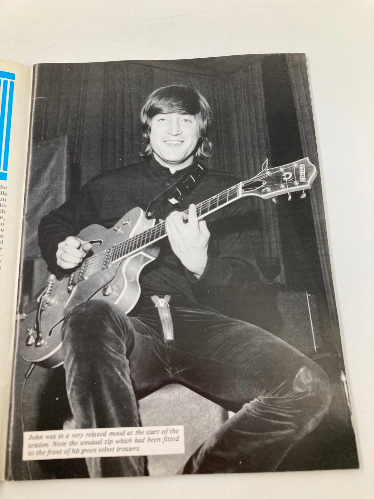 The Beatles Book Monthly Magazine March 1986 #119 featuring John Lennon smiling and holding a guitar, showcasing a relaxed atmosphere during a recording session.