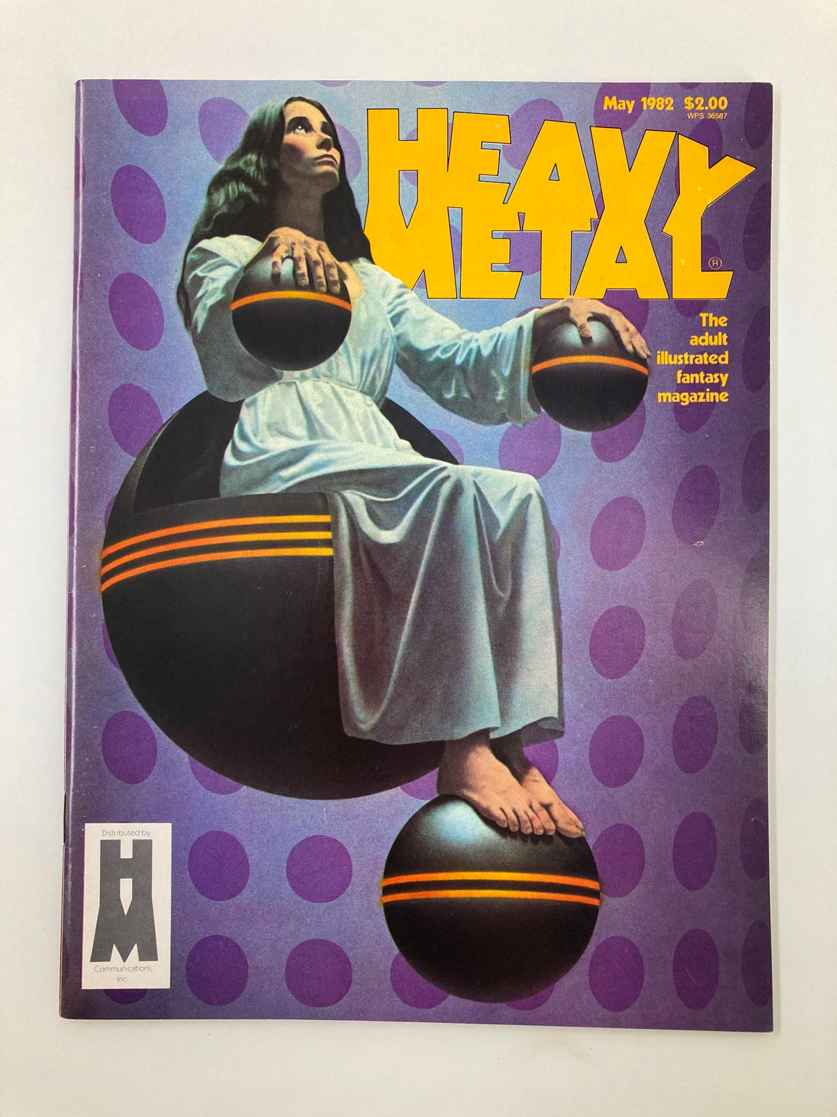 Cover of VTG Heavy Metal Magazine May 1982 featuring artwork titled 'Spheres' by Richard Cohen, showcasing a woman sitting on spheres against a vibrant purple background.
