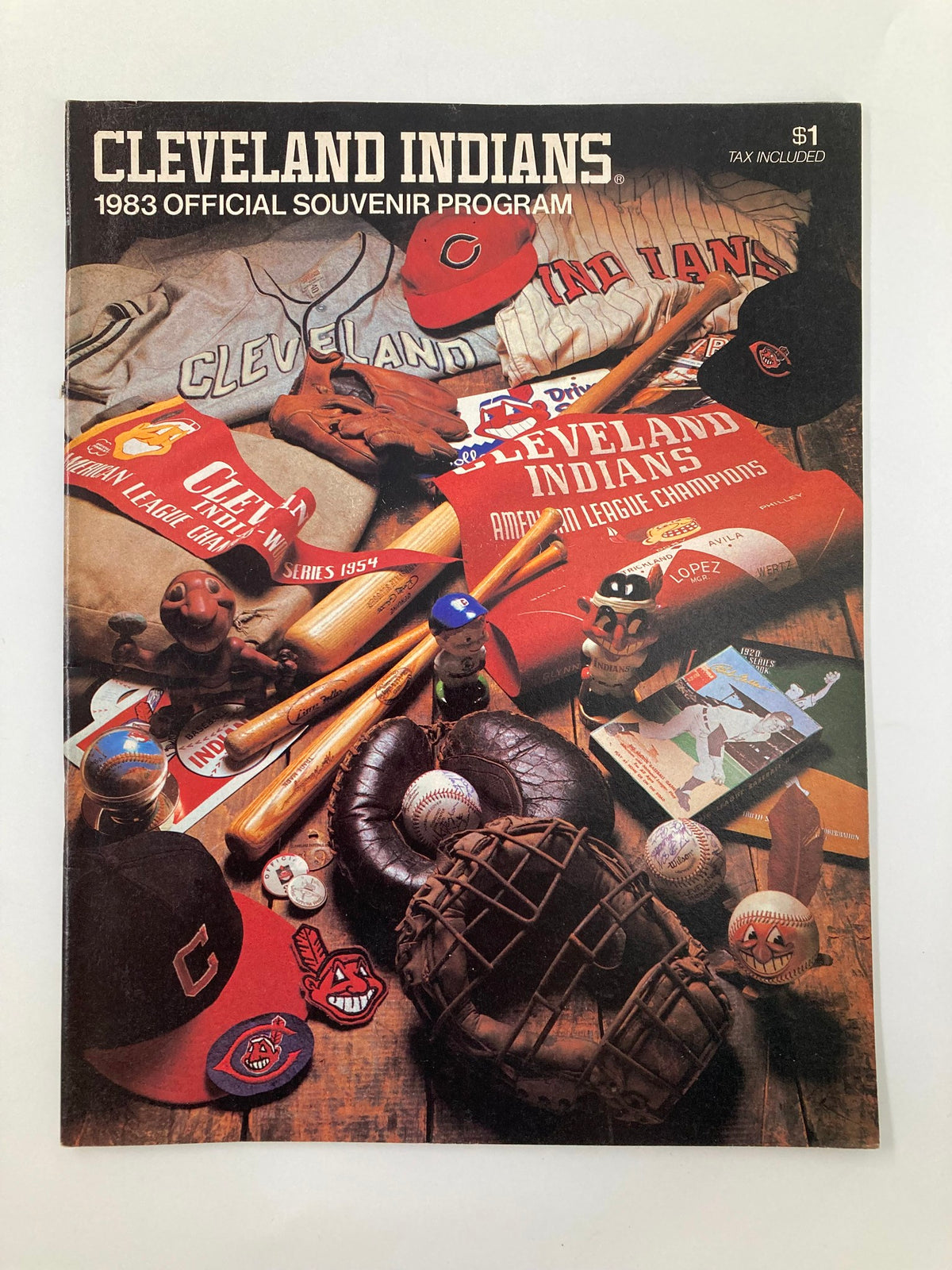 1983 MLB Cleveland Indians vs Toronto Blue Jays Official Souvenir Program cover featuring memorabilia such as caps and baseballs.