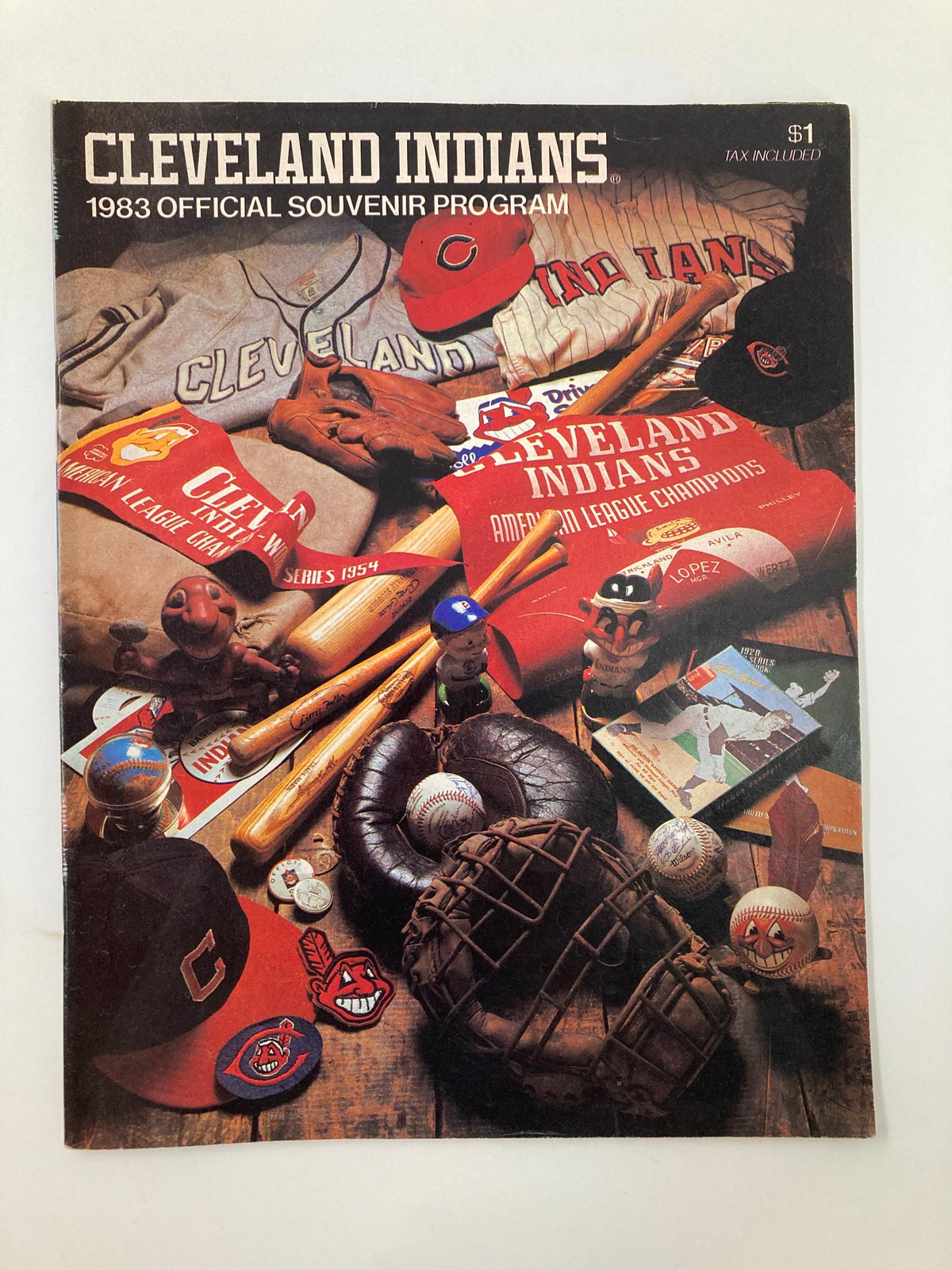 1983 MLB Cleveland Indians vs Baltimore Orioles Official Souvenir Program cover featuring baseball gear and memorabilia, including hats, jerseys, and baseballs.