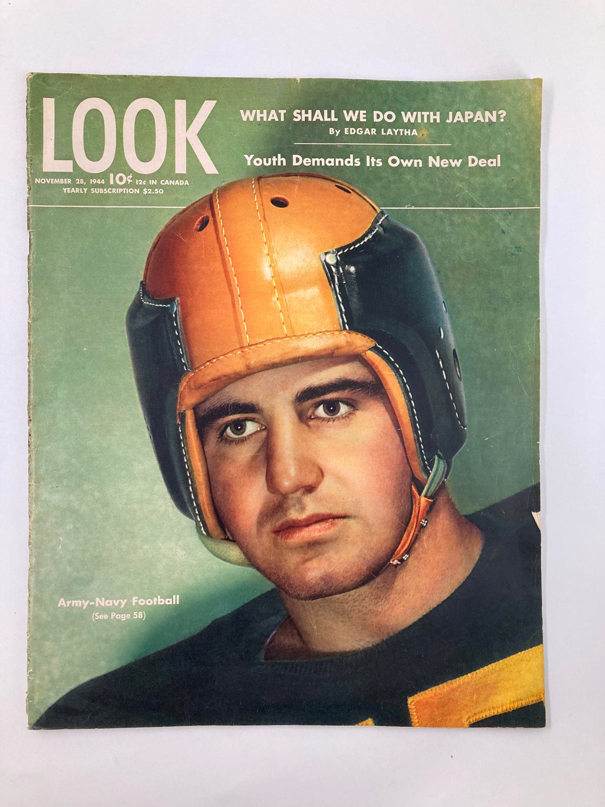 Cover of VTG Look Magazine November 28 1944, featuring Captain Ben Chase in football gear, showcasing Navy football, historical significance during World War II.
