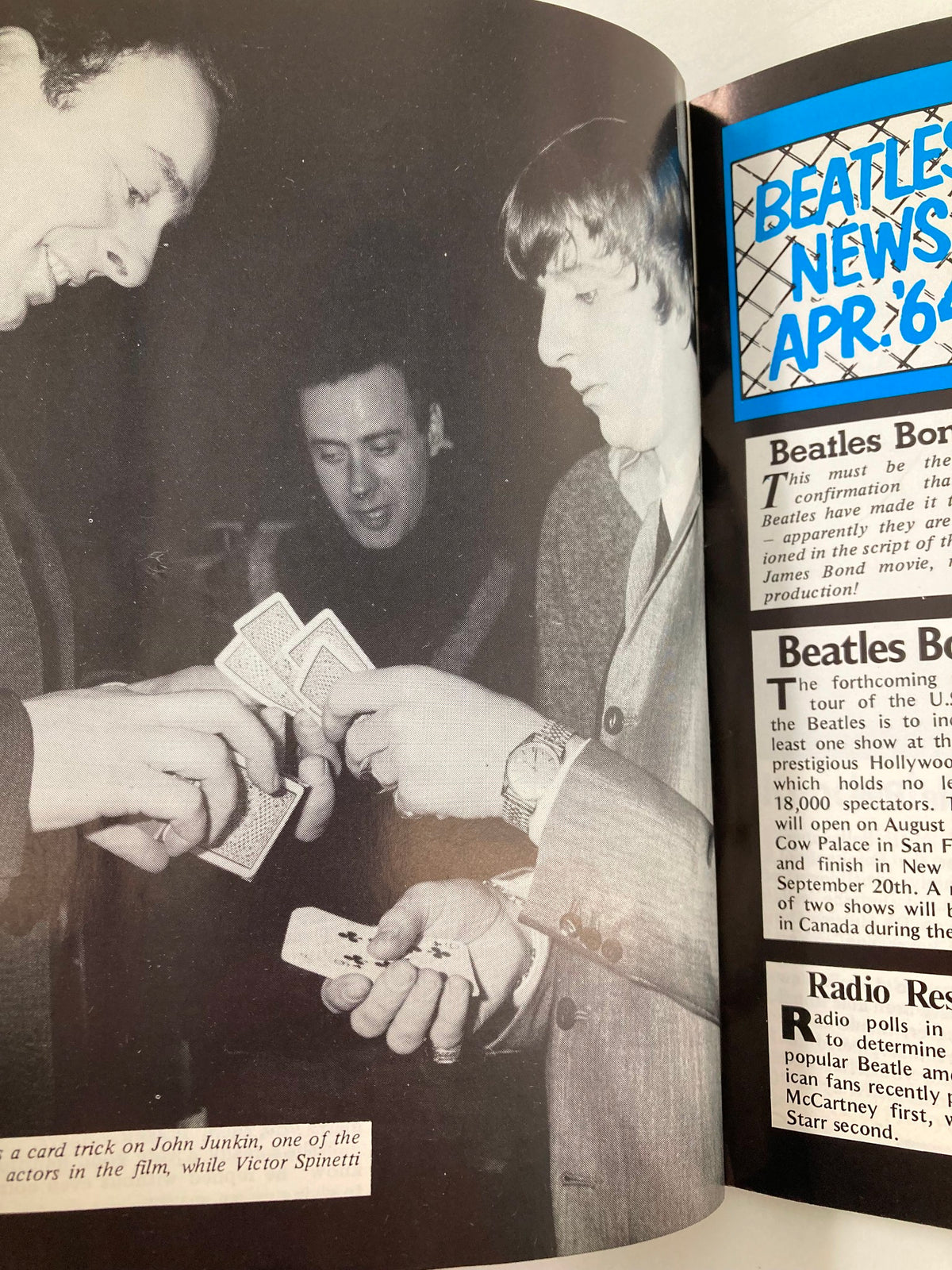 Image of John Lennon performing a card trick, taken behind the scenes of 'A Hard Day's Night', featured in 'The Beatles Book Monthly Magazine', May 1984, Issue #97.