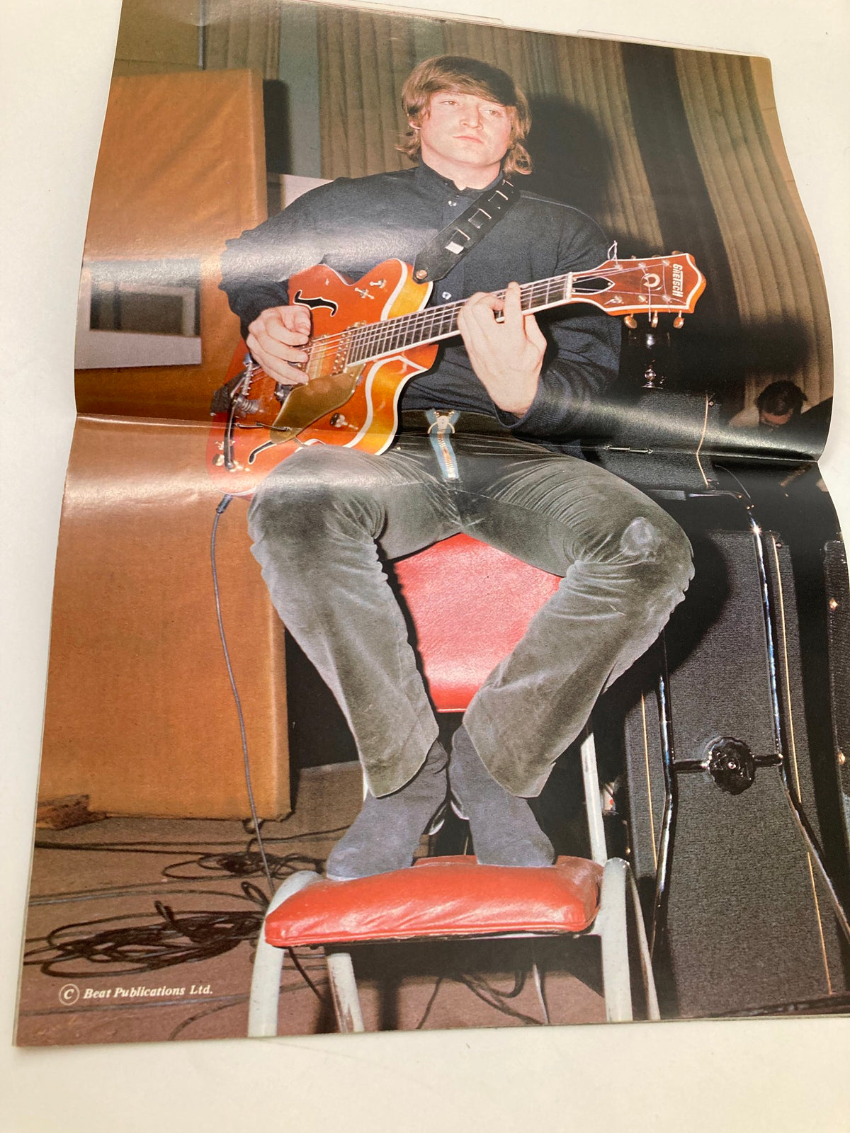 Folded photo from The Beatles Book Monthly Magazine August 1984 showcasing a band member playing guitar in a studio.