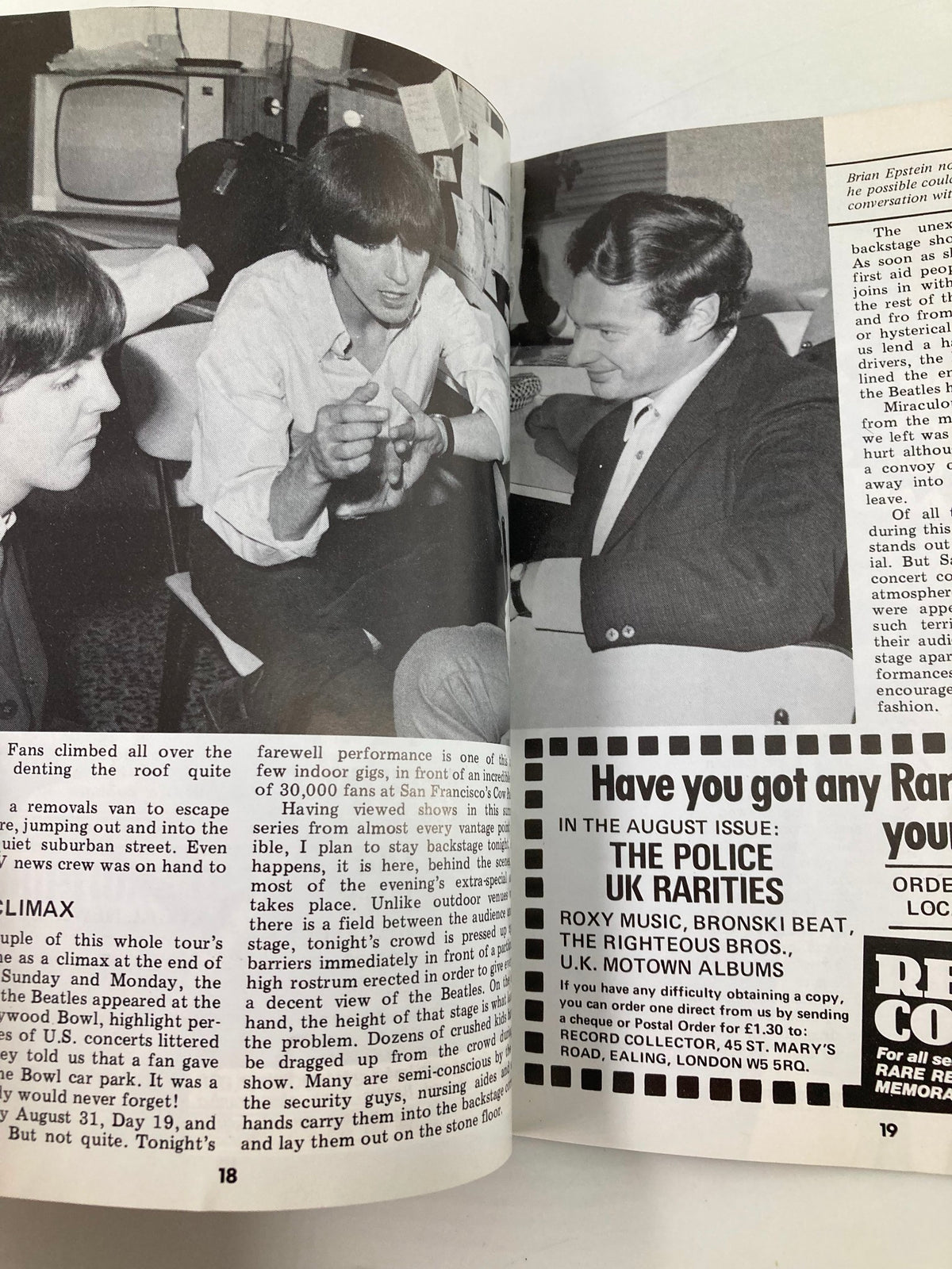 Inside page of The Beatles Book Monthly Magazine August 1985 Issue #112, displaying a historical black and white photo of Paul McCartney, George Harrison, and an unidentified man engaged in conversation, reflecting the band's dynamic during their active years.