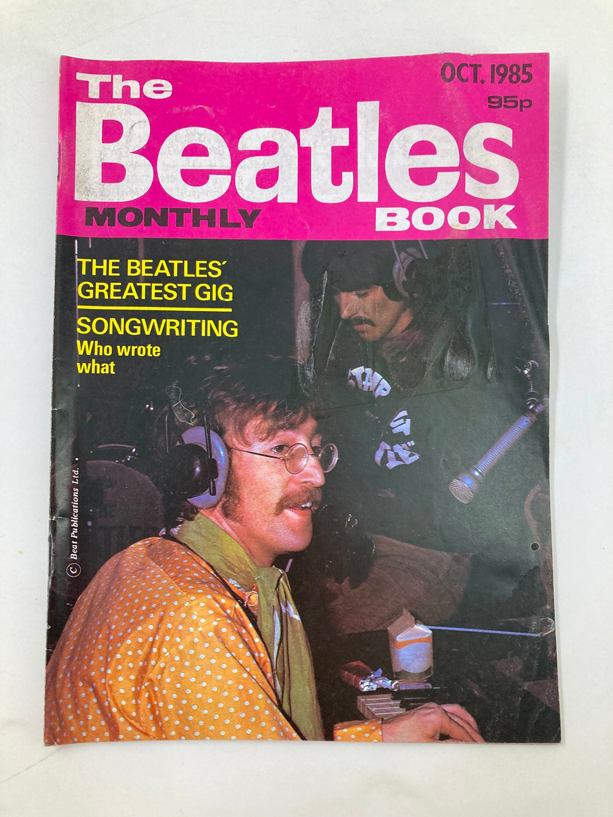 Cover of The Beatles Book Monthly Magazine, October 1985, featuring the title 'The Beatles' Greatest Gig' and a photo of John Lennon in the recording studio.