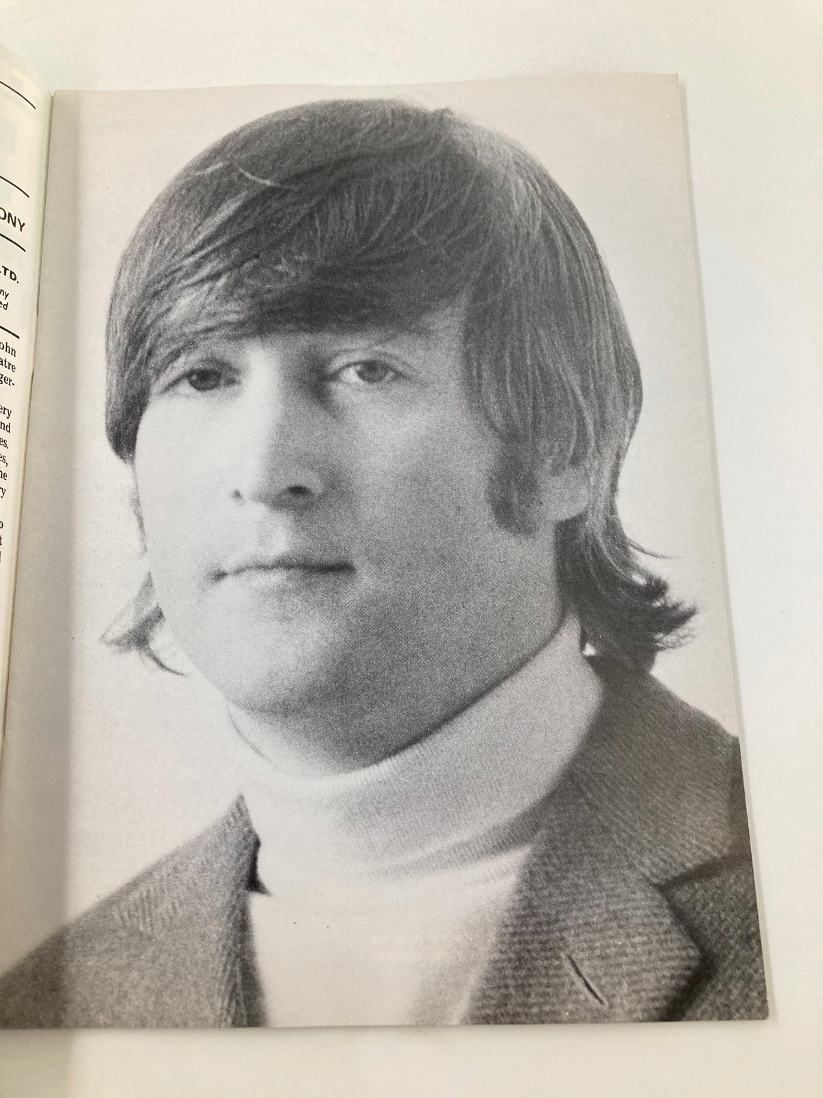 Black and white portrait of John Lennon found in The Beatles Book Monthly Magazine January 1986 #117, capturing his iconic hairstyle and style.