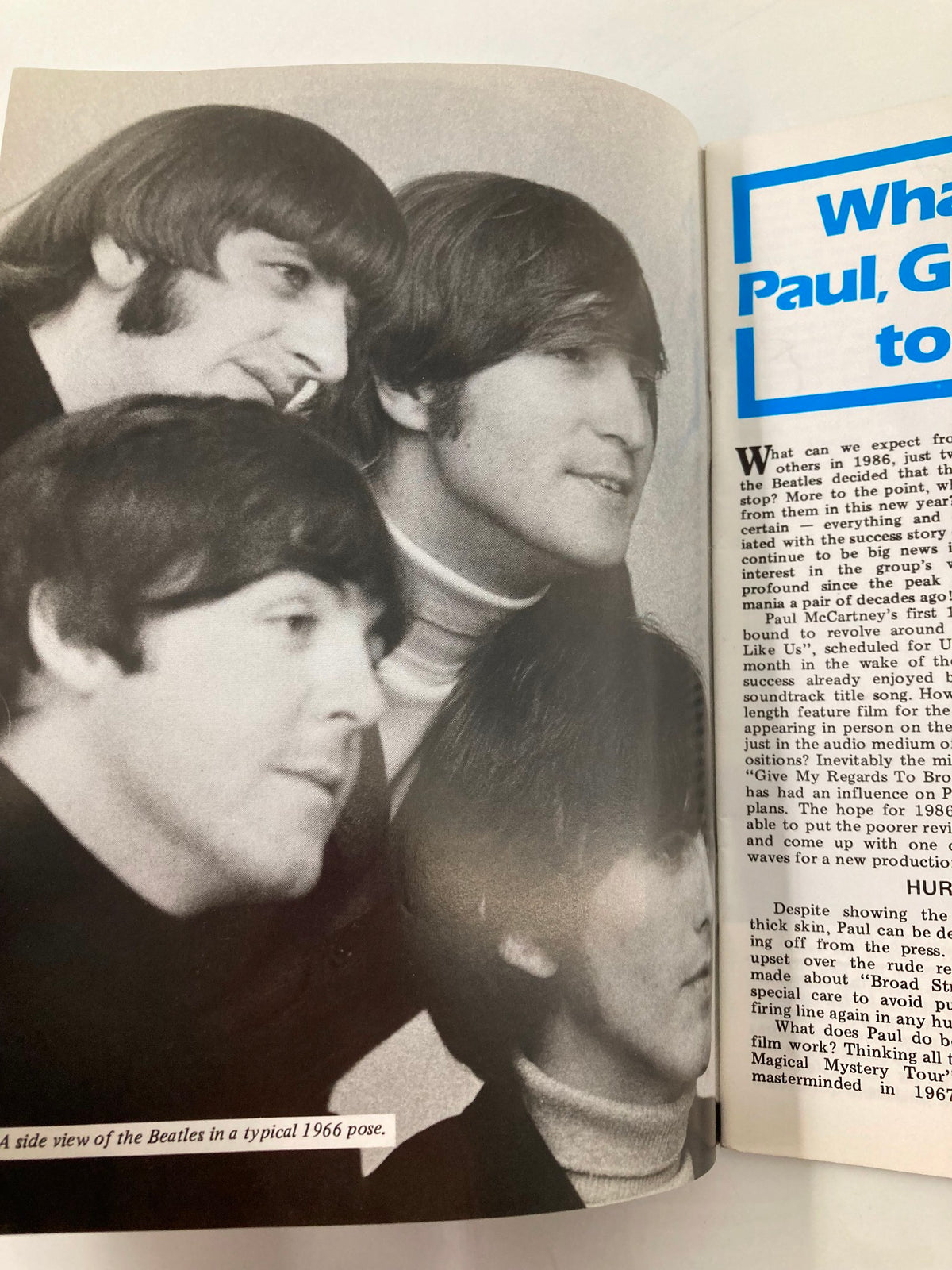 A side view image of The Beatles in a typical 1966 pose featured in The Beatles Book Monthly Magazine January 1986 #117, highlighting four members together.