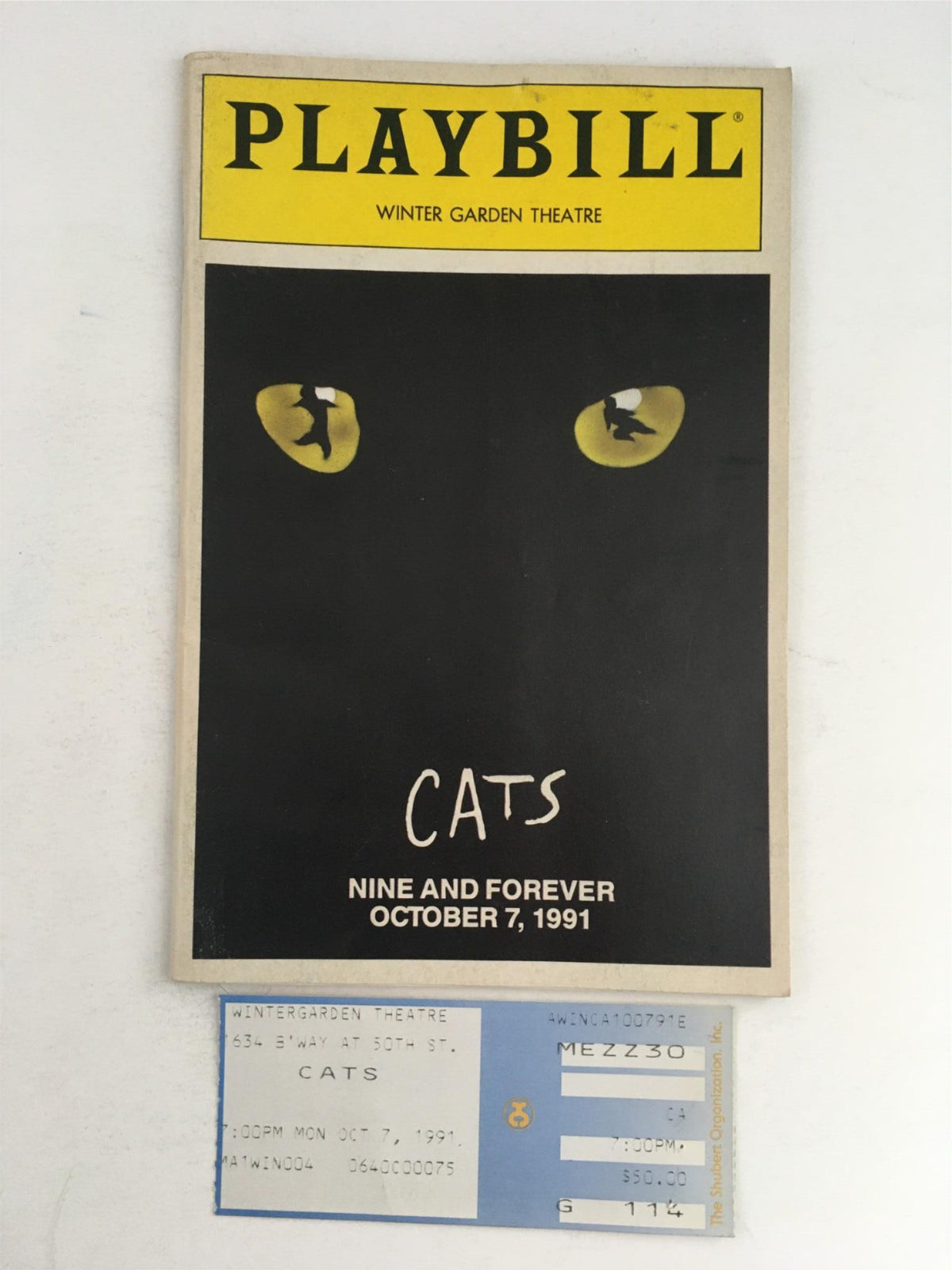 1991 Playbill for Cats Nine Forever at Winter Garden Theatre featuring a striking black cover with cat eyes and show details.