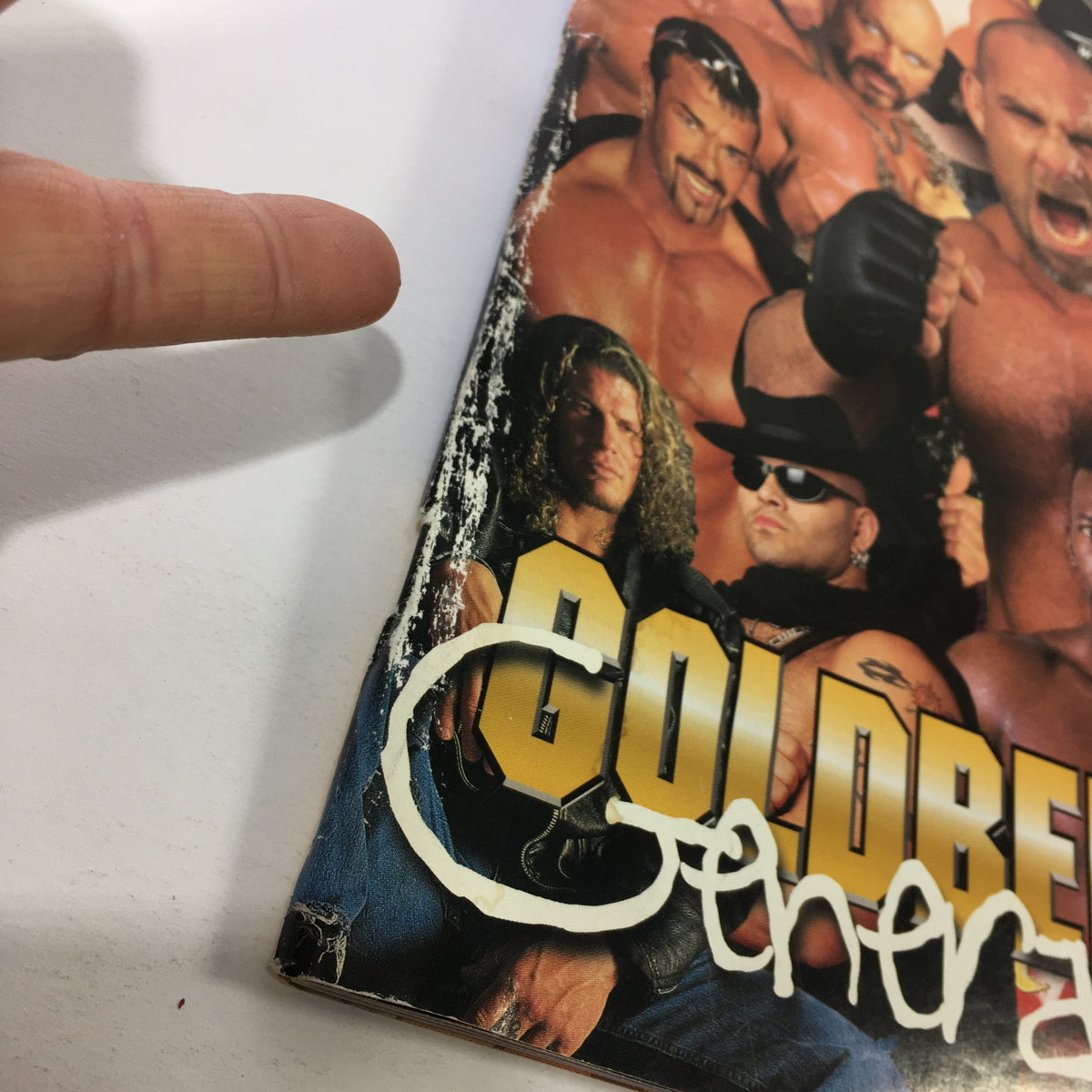 Close-up of the cover of Vintage World Championship Wrestling Magazine, July 1999, highlighting Bill Goldberg's Generation with notable wrestlers and detailing wear on the edges.