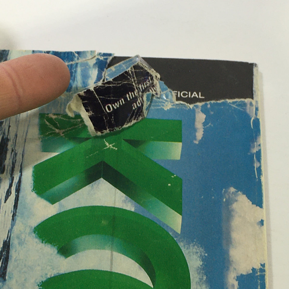 Back cover of the vintage TV Guide Magazine June 24-30, 1995, displaying remnants of an advertisement sticker and visible wear, featuring the magazine's nostalgic branding.