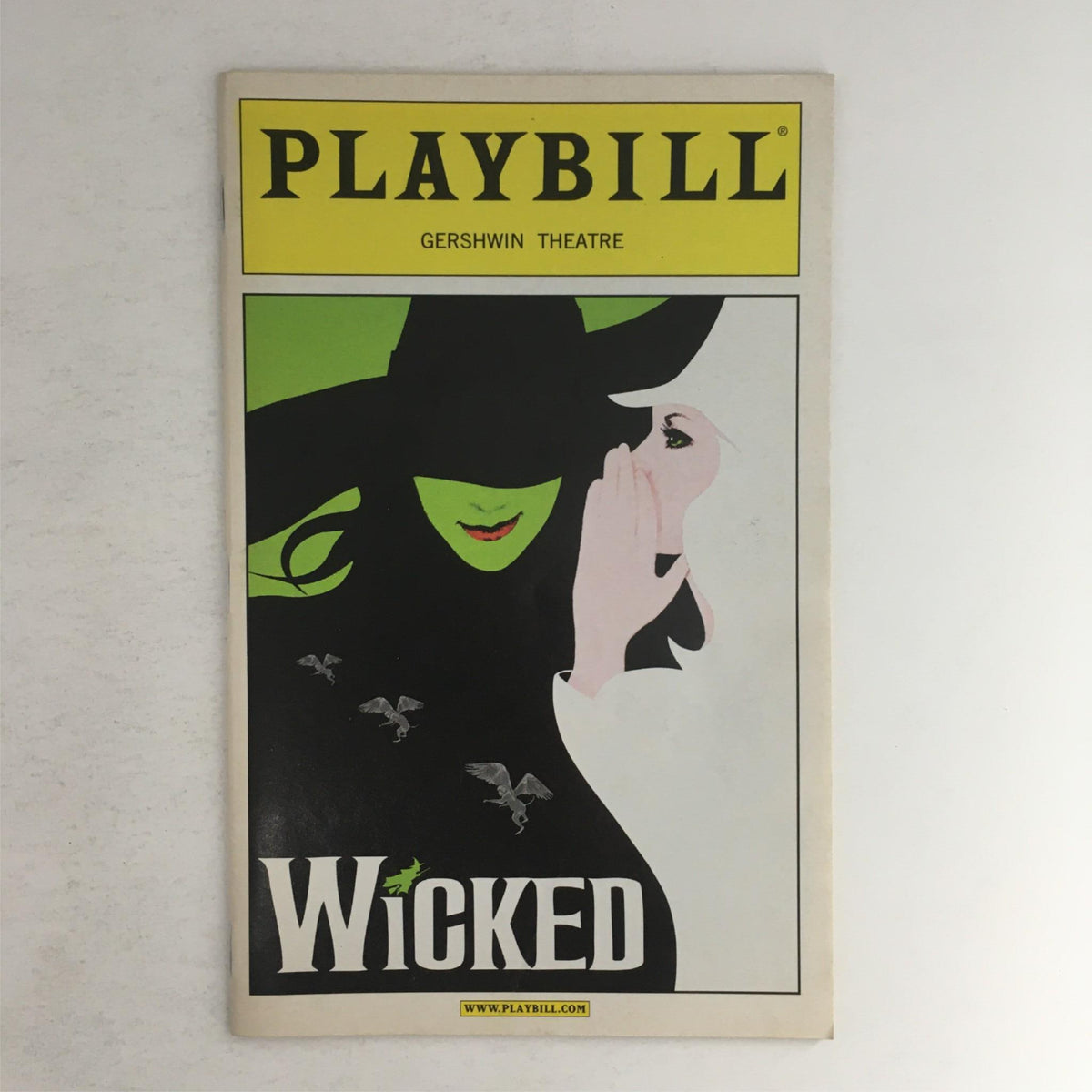 2009 Playbill Wicked featuring cover art with a green witch silhouette, held at Gershwin Theatre.