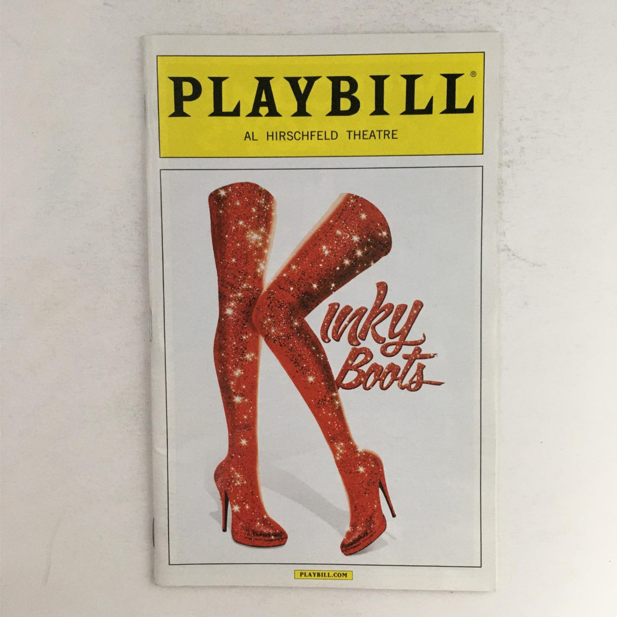 2015 Playbill for Kinky Boots at Al Hirschfeld Theatre featuring striking red sequined high heels.