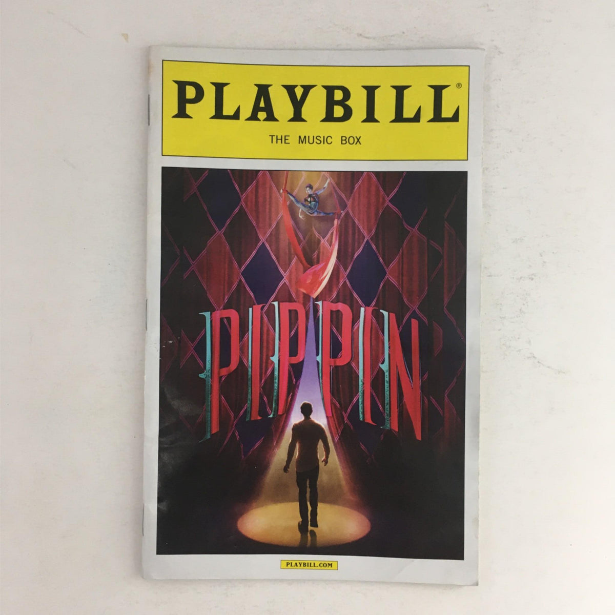 Cover of the 2013 Playbill for Pippin at The Music Box featuring a vibrant illustration and the title PIPPIN prominently displayed.