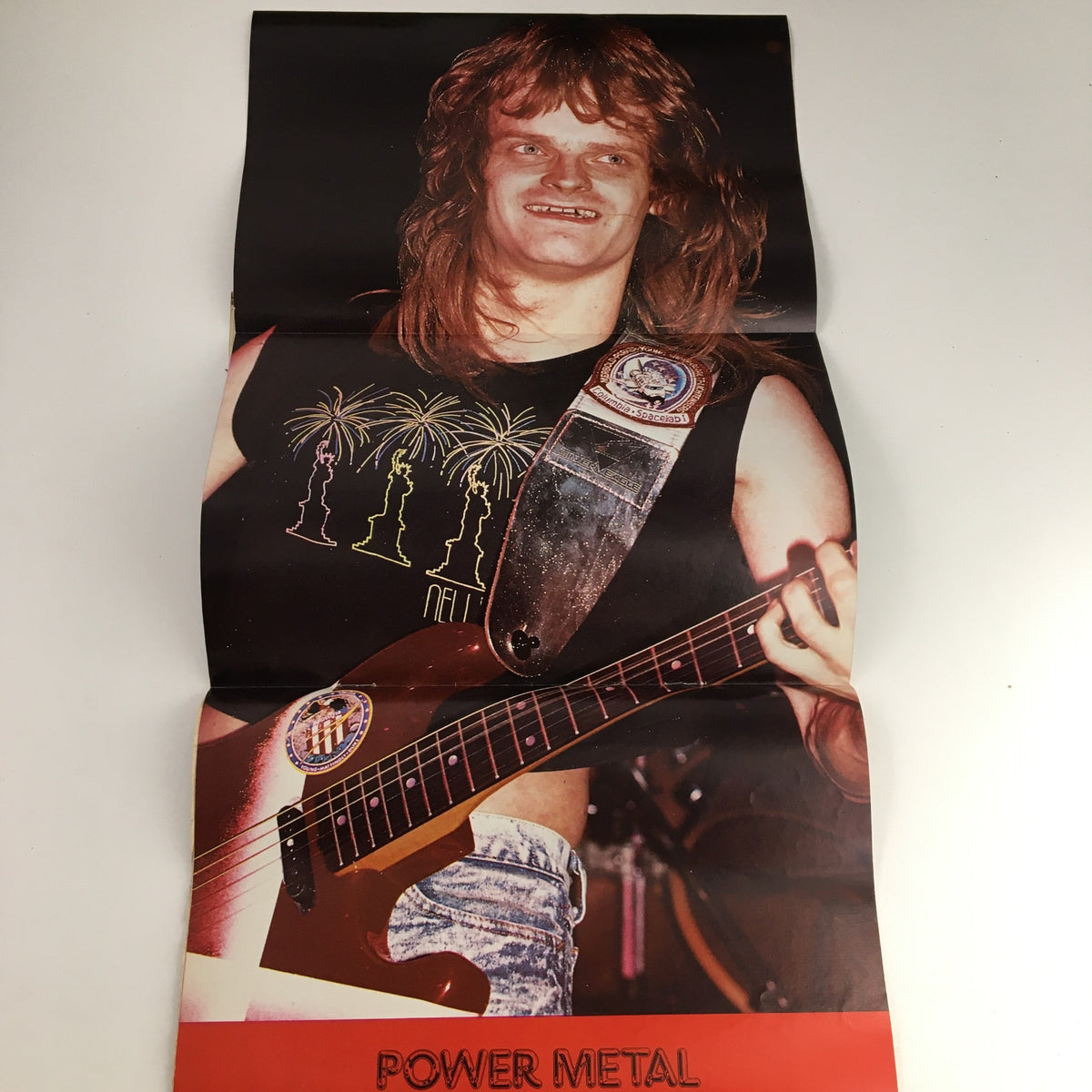 Image from Hit Parader Power Metal June 1989 featuring a guitarist with long hair and a vibrant performance shirt, included in the issue with Metallica on tour.