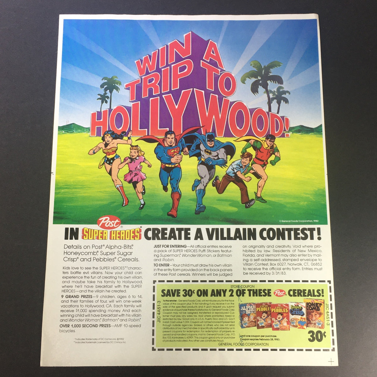 Vintage 1983 Post Cereals DC Comics Super Heroes advertisement featuring a contest to win a trip to Hollywood, displaying iconic superheroes like Superman, Wonder Woman, and Batman in a colorful design.