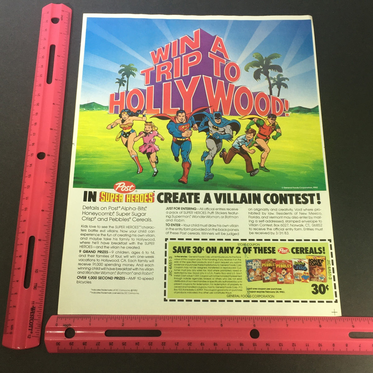 VTG 1983 Post Cereals DC Comics Super Heroes Win A Trip To Hollywood Ad Coupon featuring colorful superheroes including Batman, Superman, and Wonder Woman, promoting a contest with details for kids, alongside a coupon for savings on cereals.