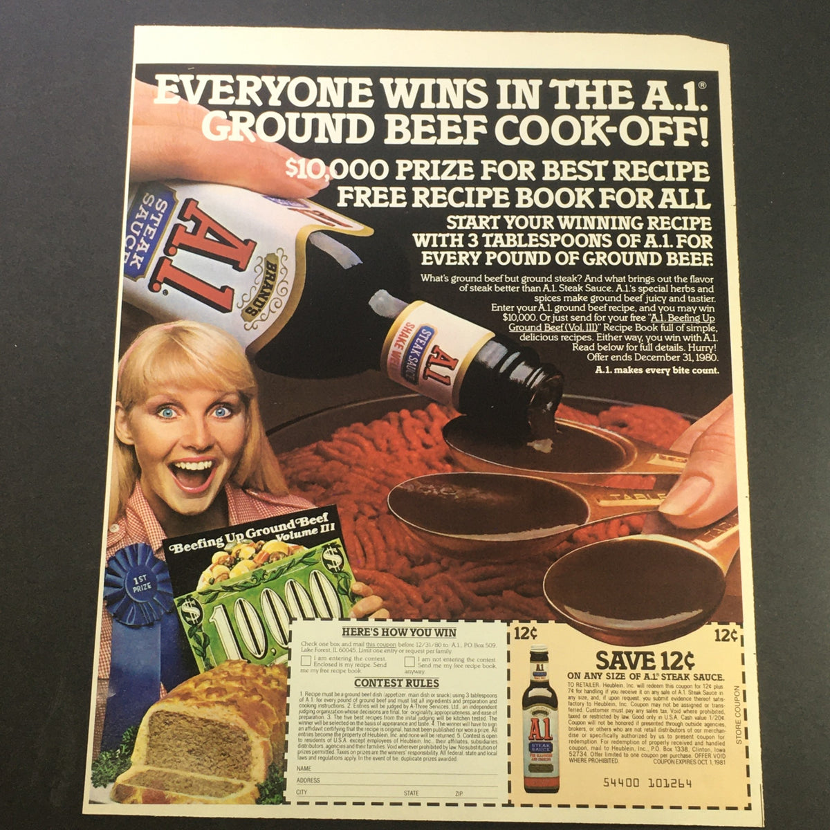 VTG Retro 1981 Brand's A1 Steak Sauce ad showcasing a fun cooking contest with a $10,000 prize, featuring a smiling woman and details on recipe submissions.