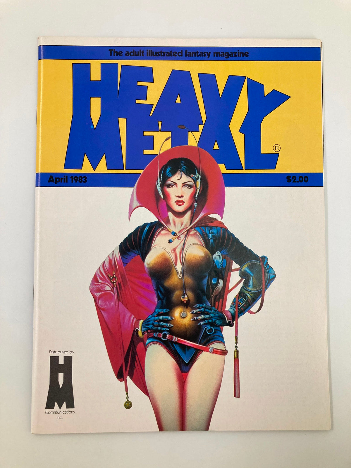 Cover of Heavy Metal Magazine April 1983 featuring the iconic illustration of a woman in a futuristic outfit. The title 'HEAVY METAL' prominently displayed at the top, highlighting the magazine's focus on adult illustrated fantasy.