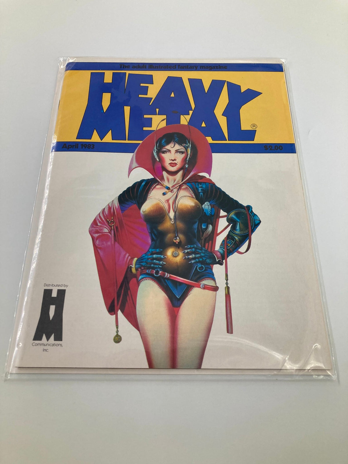 Heavy Metal Magazine April 1983 securely bagged, displaying the striking cover art of a woman in a science fiction theme. The magazine is labeled as an adult illustrated fantasy publication, emphasizing its collectible value.