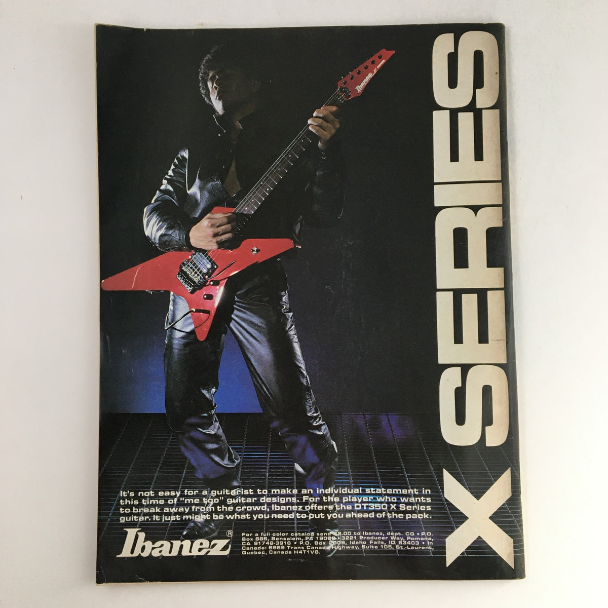 Ibanez advertisement featuring a guitarist in a leather jacket holding a red guitar, promoting the X Series, associated with Circus Magazine August 31 1985 Don Dokken & Paul Stanley Kiss, with poster.