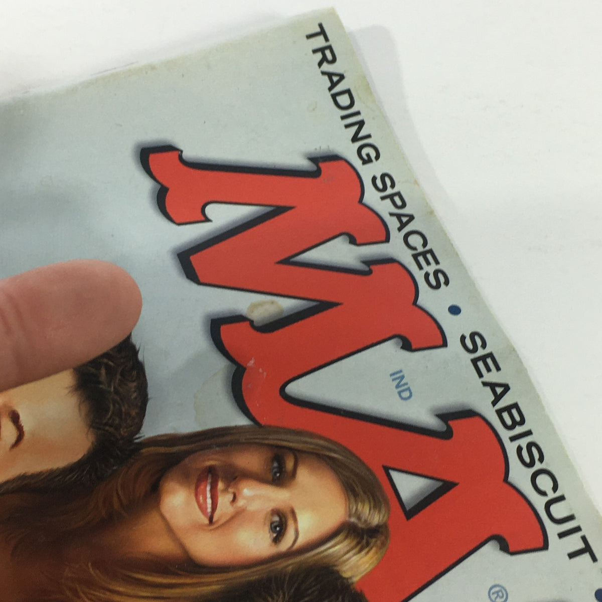 Close-up of the side edge of Mad Magazine November 2003, highlighting the title and some minor wear, indicative of its vintage condition.