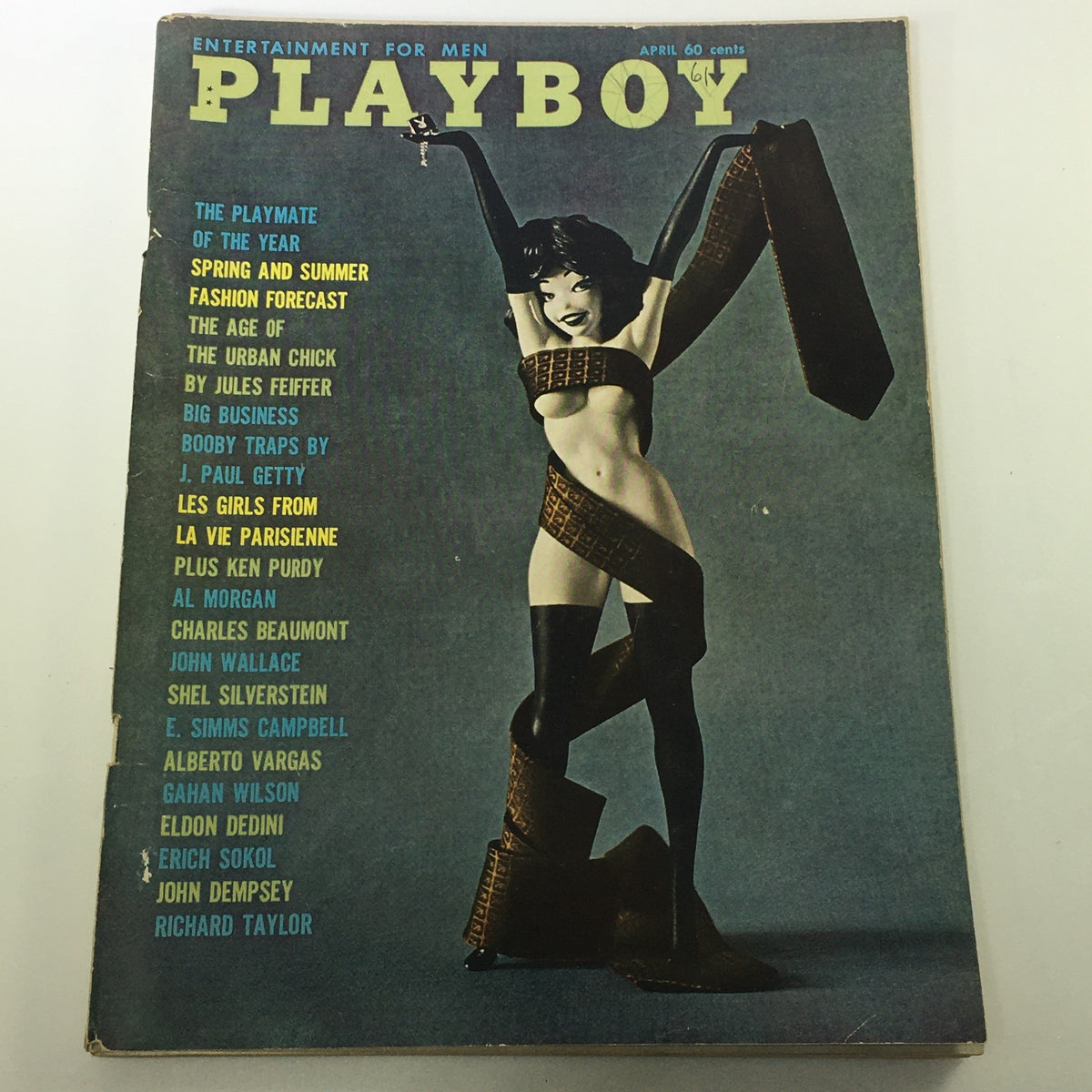 VTG Playboy Magazine April 1961 cover featuring Playmate Nancy Nielsen, showcasing vintage art and design elements.