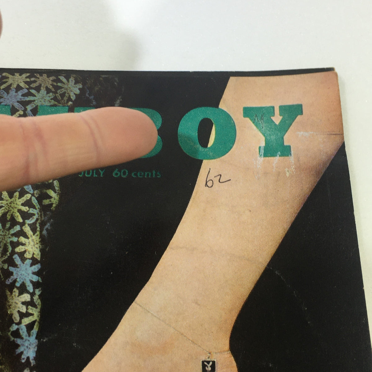 Close-up of the VTG Playboy Magazine July 1962 cover, highlighting the magazine's title and design details.