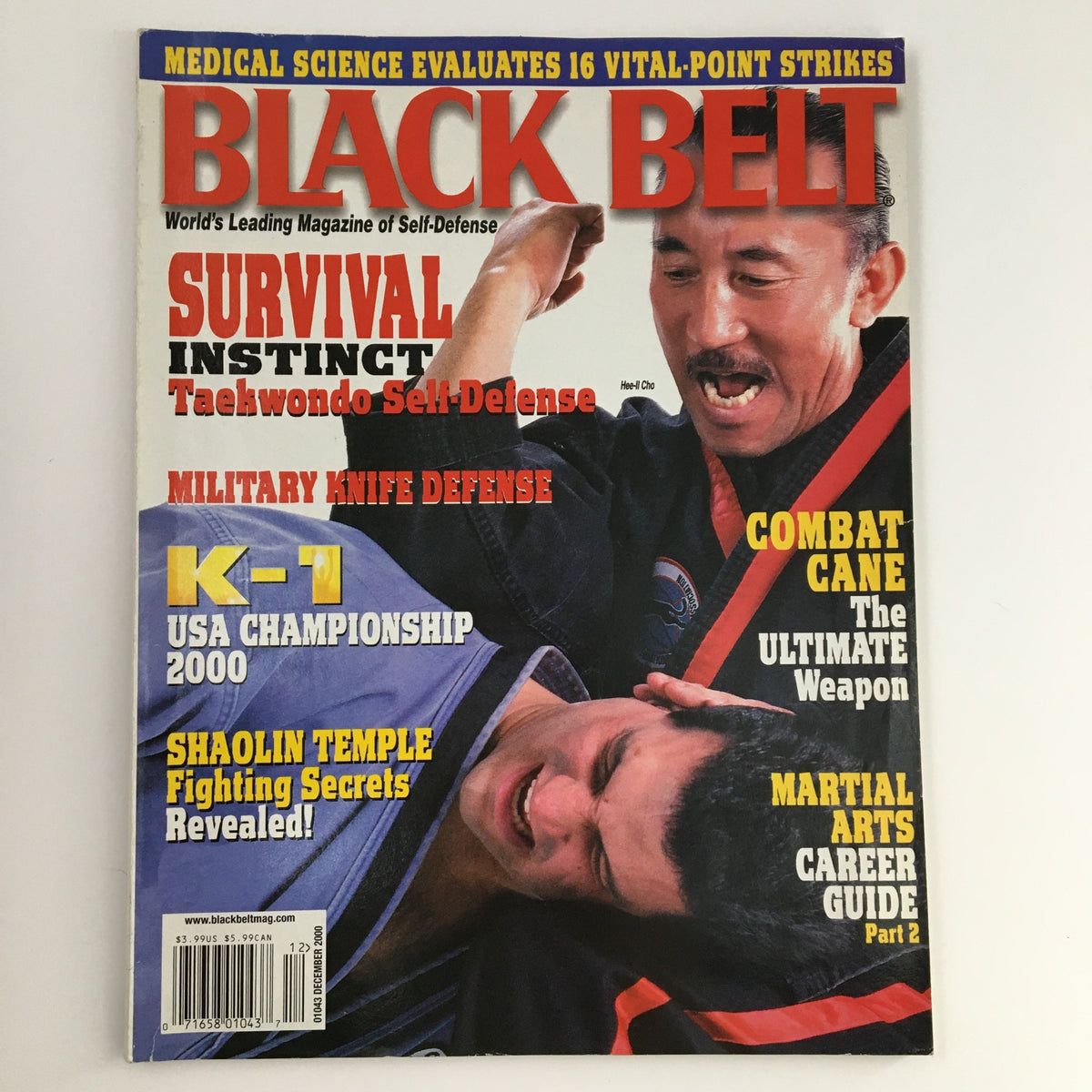 Cover of Black Belt Magazine December 2000 featuring martial artists in a self-defense scenario, highlighting articles on survival instinct, military knife defense, and K-1 USA Championship.