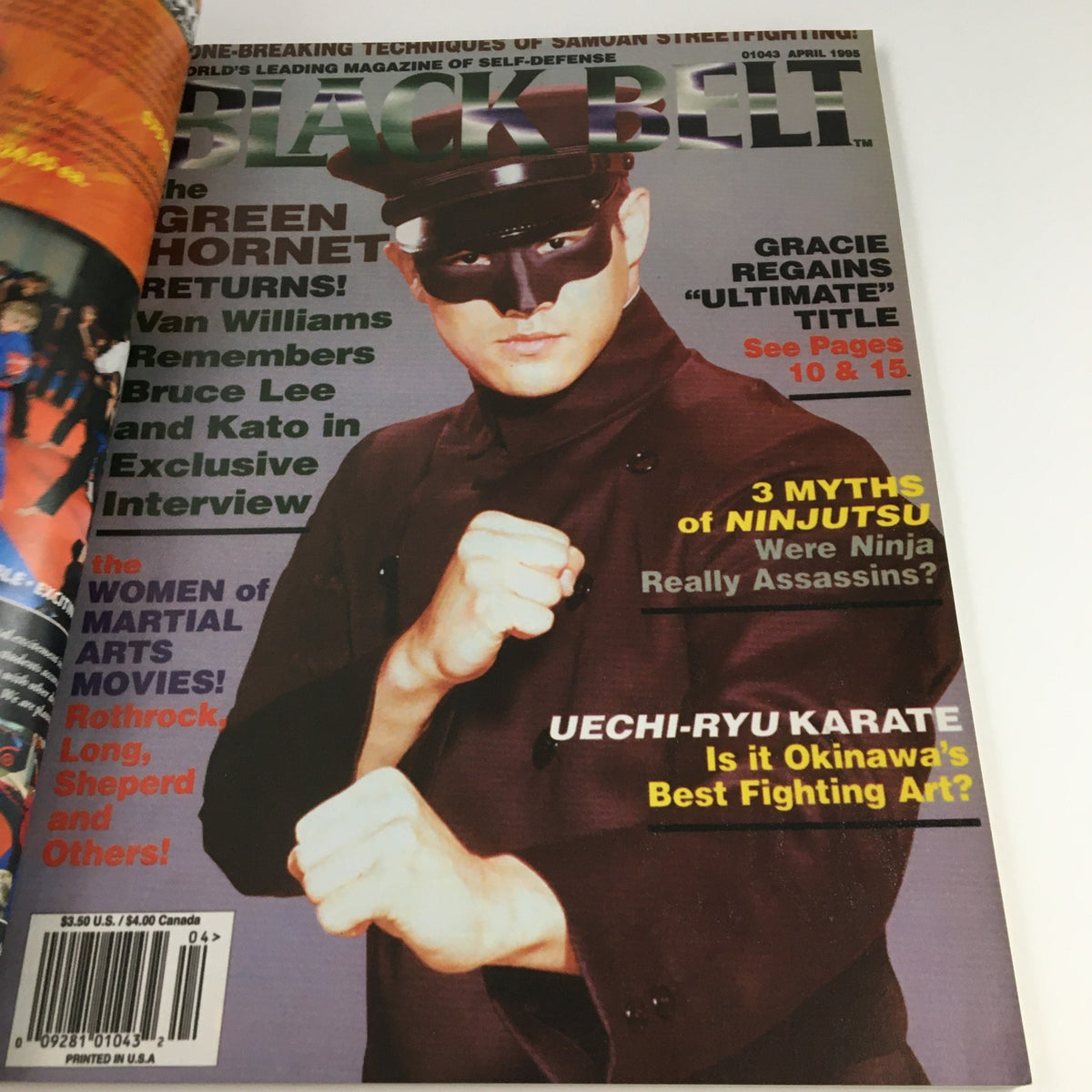 Cover of Black Belt Magazine featuring a character in a black outfit and sunglasses, promoting the martial arts theme for the November 2007 Vol 45 #11 Bruce Lee Issue.