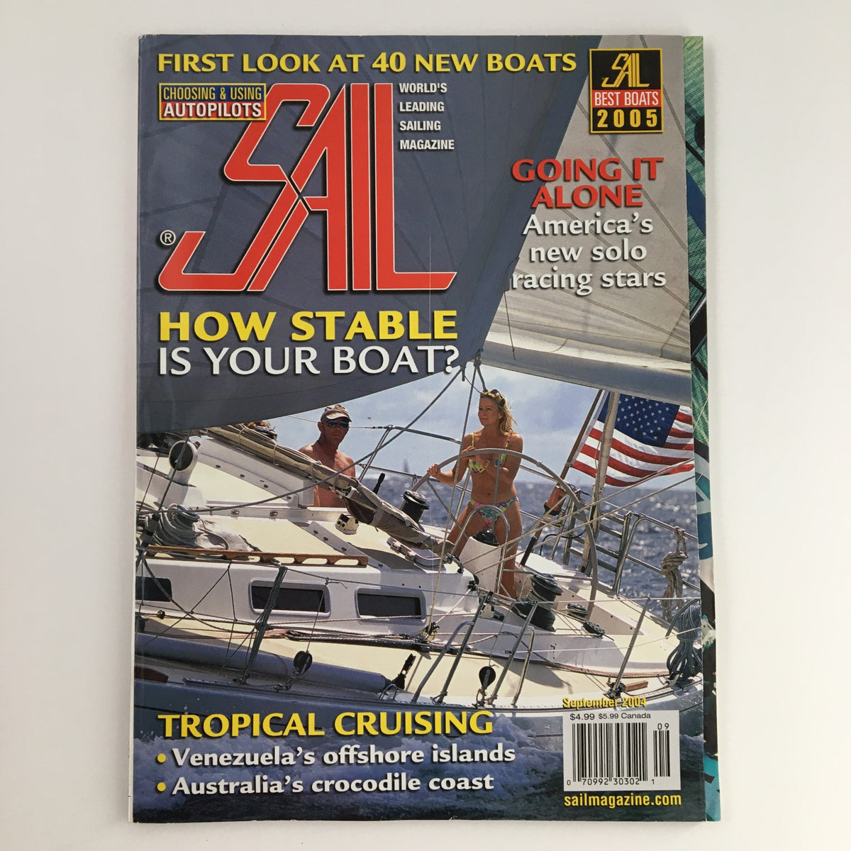 Cover of Sail Magazine September 2004 featuring 'America's New Solo Racing Stars.' The cover has vibrant sailing imagery and includes articles on boat stability, tropical cruising, and new boats.