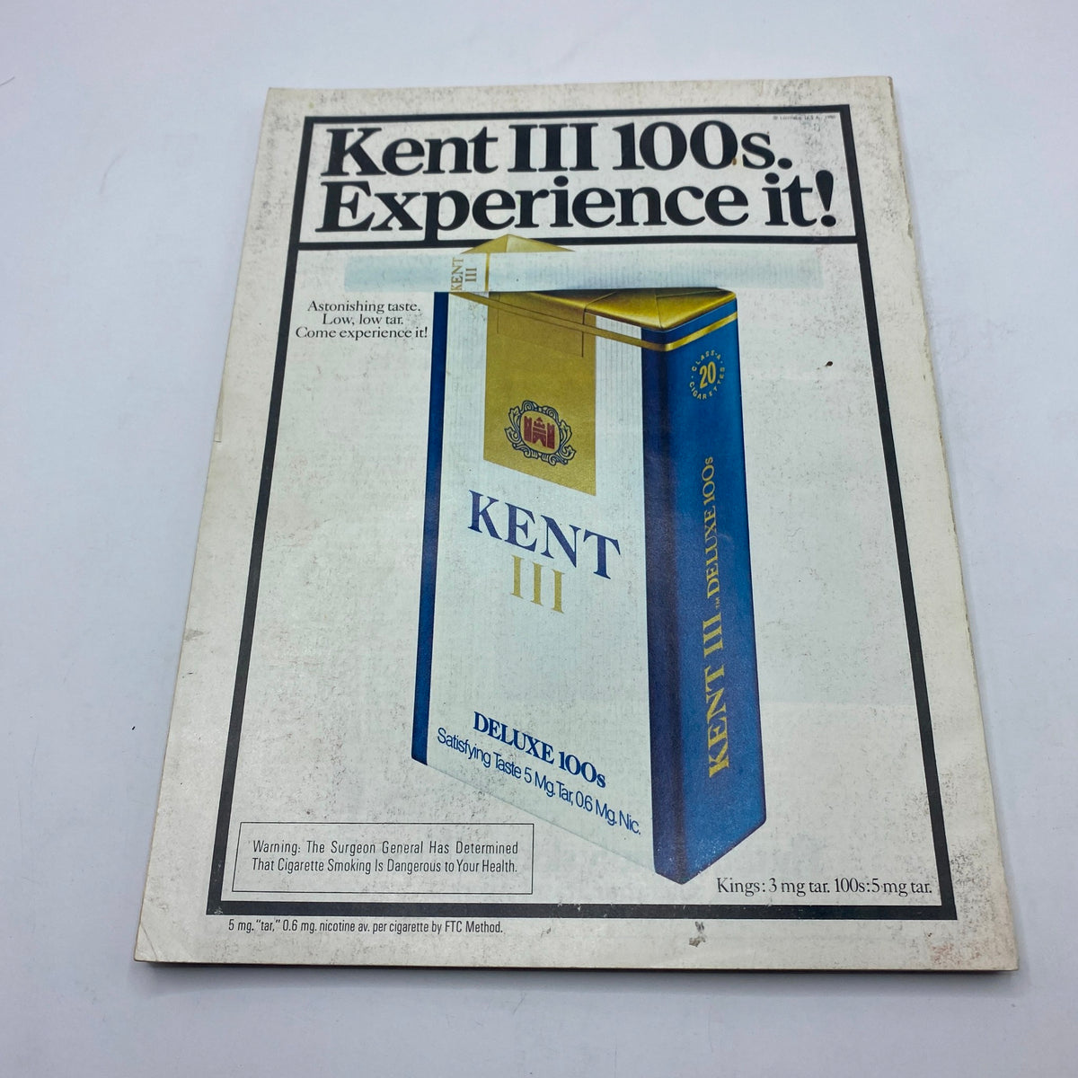 Advertisement for Kent III 100s cigarettes included in VTG Vogue Magazine July 1980, depicting 1980s marketing aesthetics.