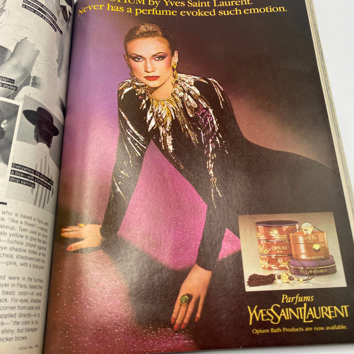 Vogue Magazine May 1980 featuring a striking ad for Yves Saint Laurent Opium perfume, showcasing a glamorous model adorned in sparkling attire, highlighted by Richard Avedon's iconic photography.