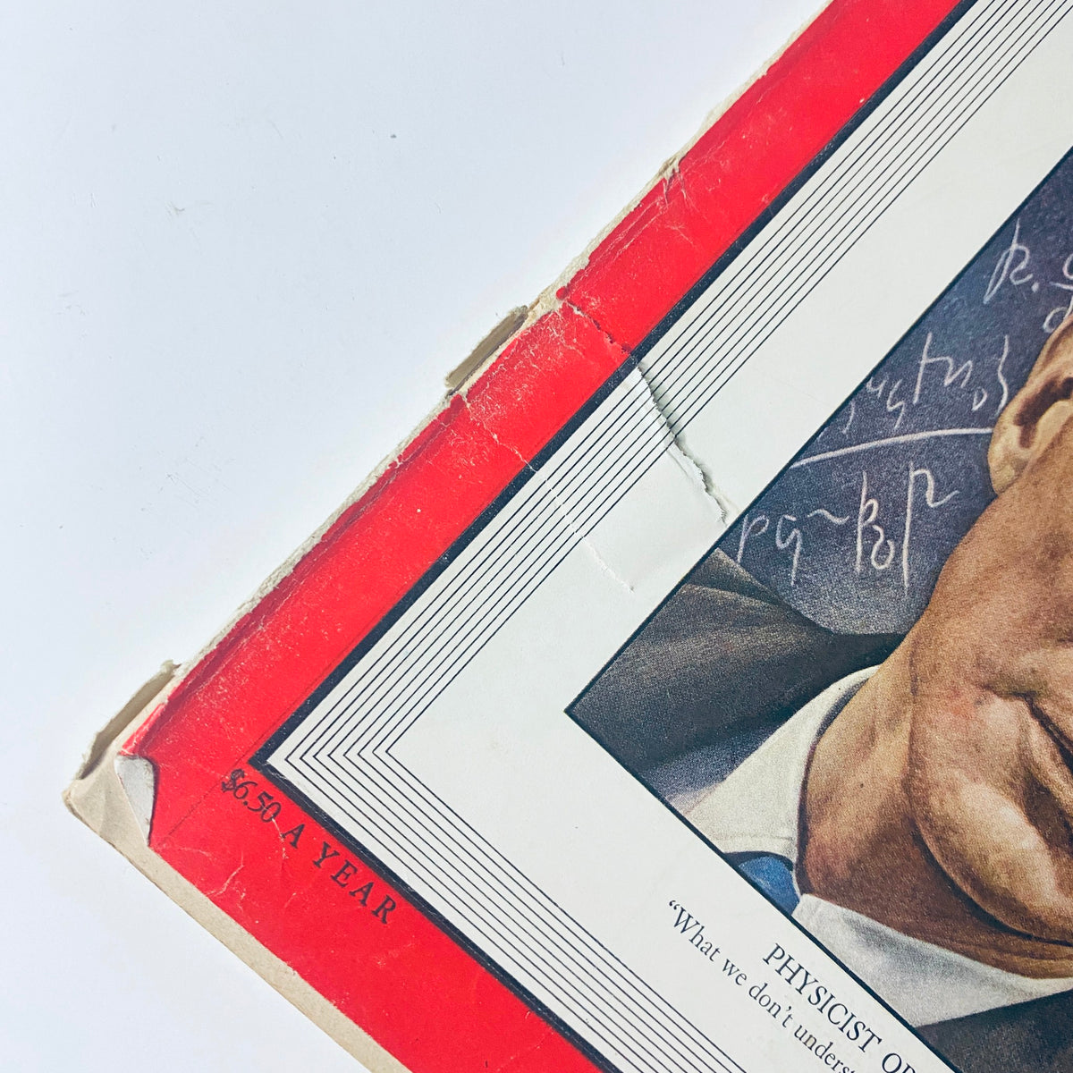 Close-up view of the edge of Time Magazine November 8, 1948 showcasing J. Robert Oppenheimer's cover, including visible wear and the magazine's annual subscription price.