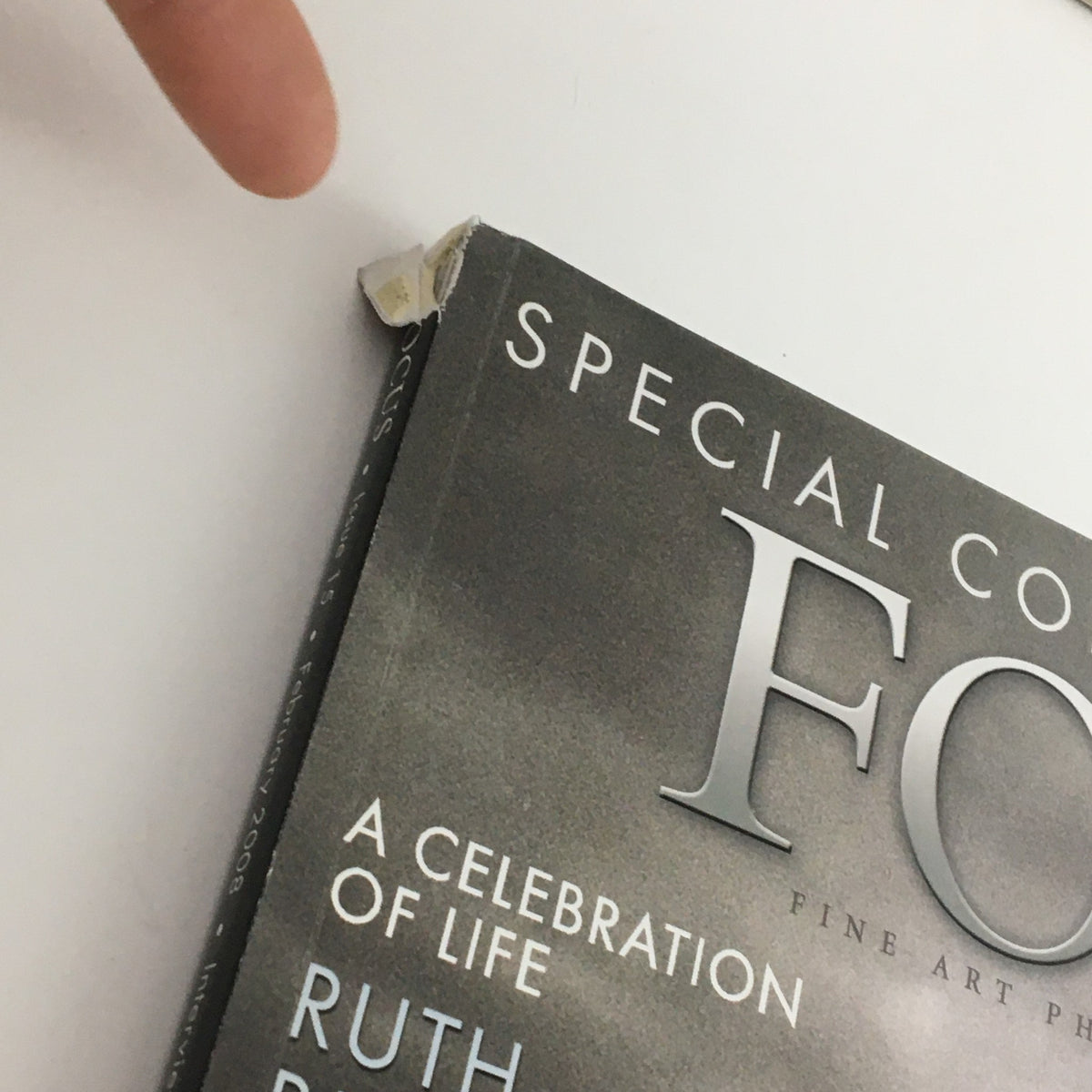 Close-up of the top corner of Focus Photography Magazine February 2008, displaying minor wear and tear on the edge, indicative of its vintage condition.