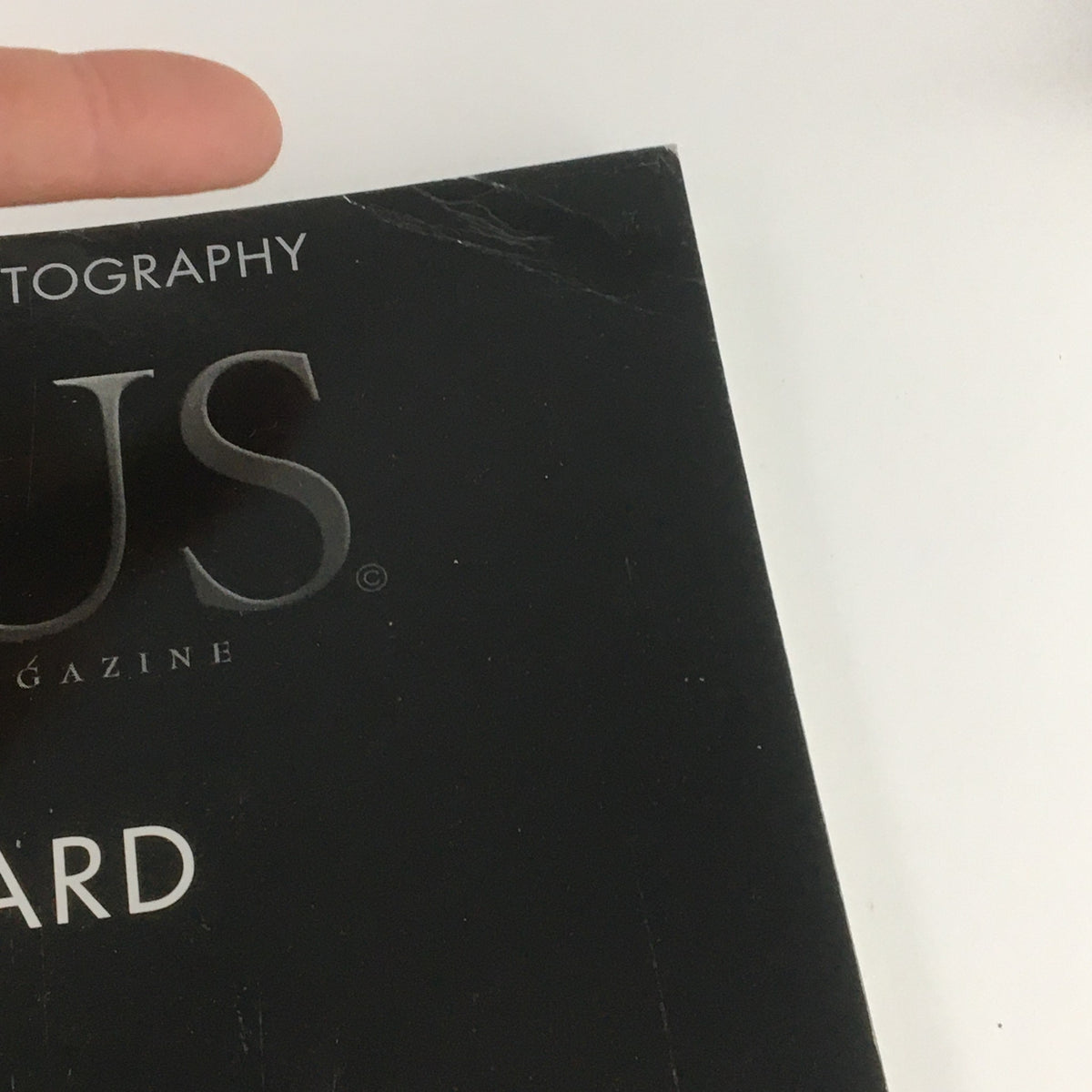 Close-up of the spine of Focus Photography Magazine, February 2007, highlighting the title and name Ruth Bernhard (1905-2006), illustrating magazine wear.