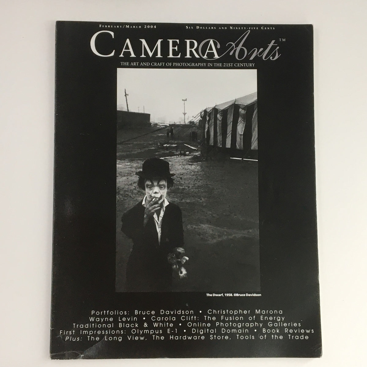 Camera Arts Magazine February 2004 featuring Bruce Davidson's photograph 'The Dwarf 1958' on the cover, showcasing a black and white image of a clown character.